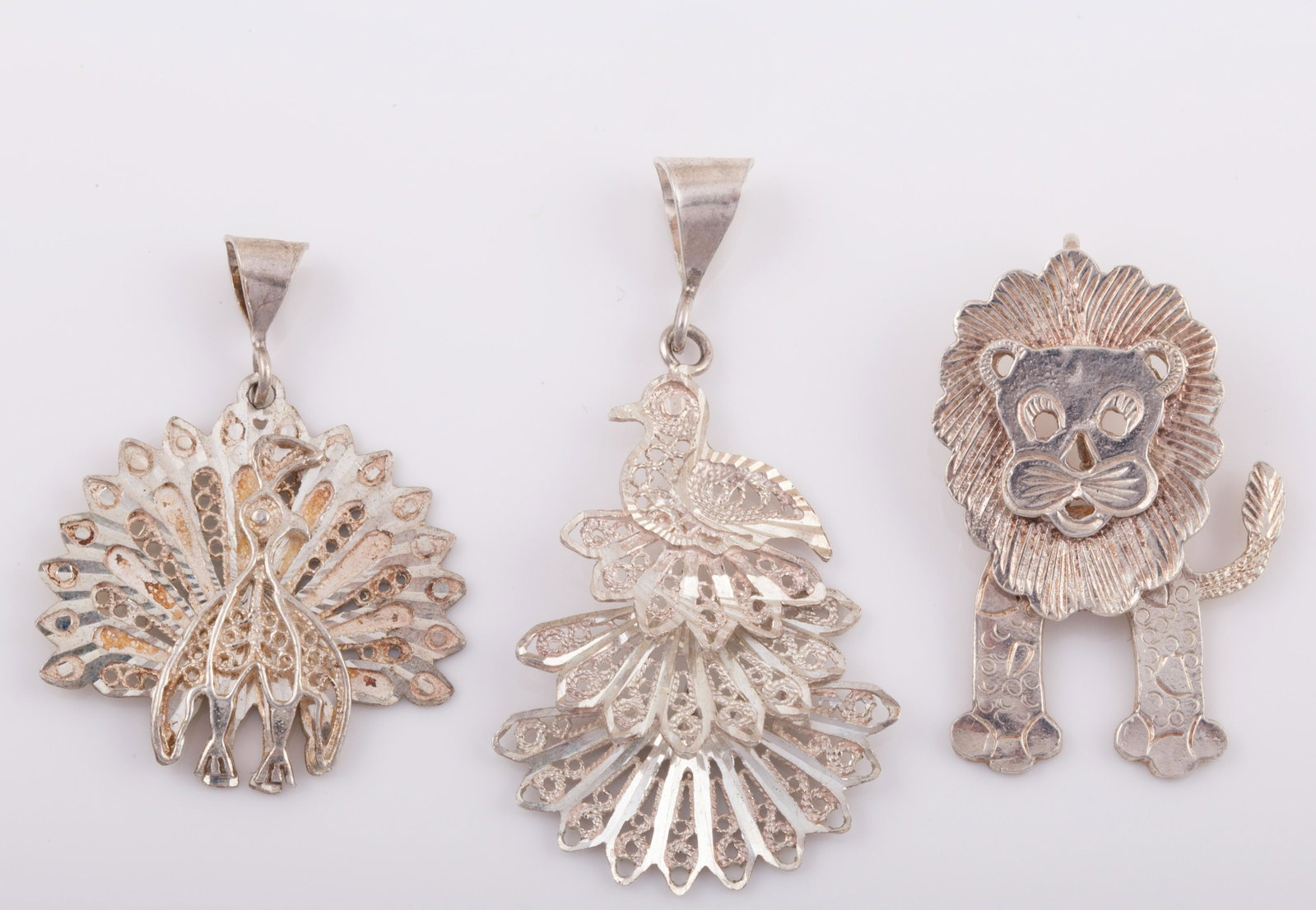 (3) STERLING ANIMAL NECKLACE PENDANTS: (1) Peacock (1) Kinetic Bird (1) Kinetic Lion, .29 ozt L - 1 1/4 - 1 1/2" VG - EX