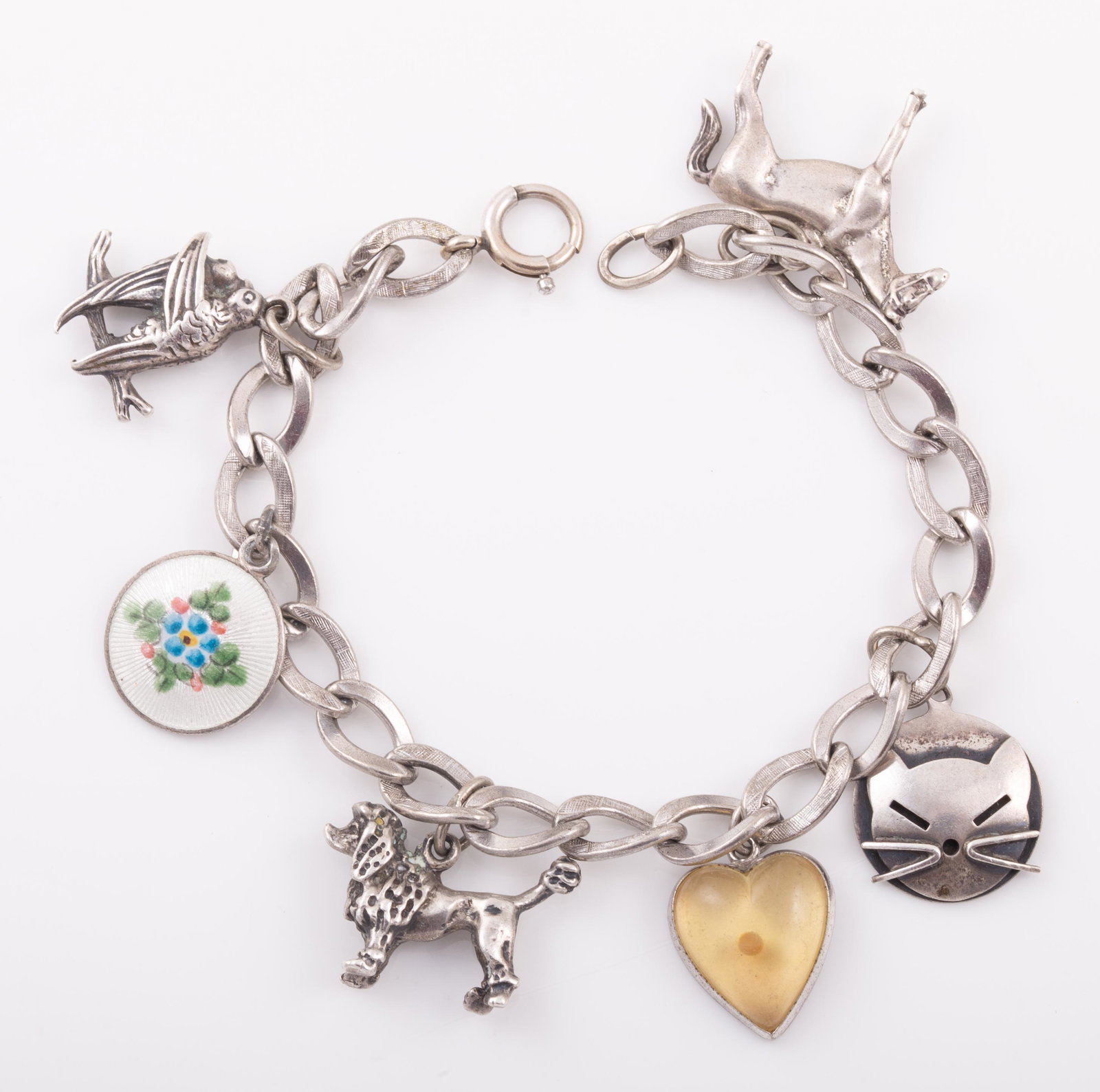STERLING CHARM BRACELET with ANIMAL CHARMS: Horse, poodle, cat, and lovebirds stamped Beau sterling; bracelet also includes guilloche enamel floral disc, heart-shaped mustard seed charm; clasp stamped 12KTGF; textured links, L-7", [.86 ozt tota