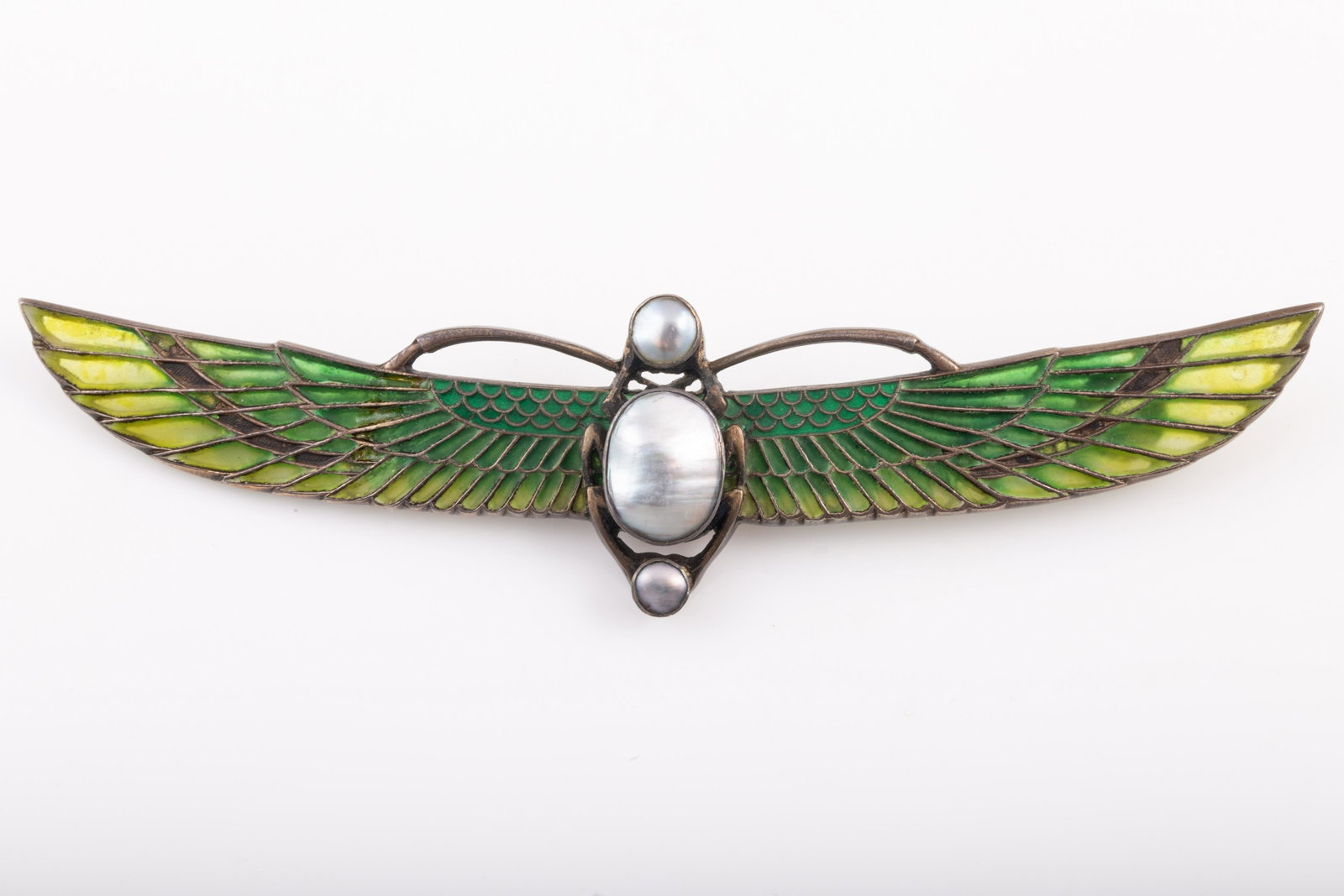 HEINRICH LEVINGER EGYPTIAN REVIVAL PLIQUE A JOUR BROOCH: Silver brooch with varying shades of green enamel; reverse bears signature of Heinrich Levinger, also stamped Depose 900; baroque pearls make up body of scarab; body 13 x 10mm , with 5mm and 6 mm head