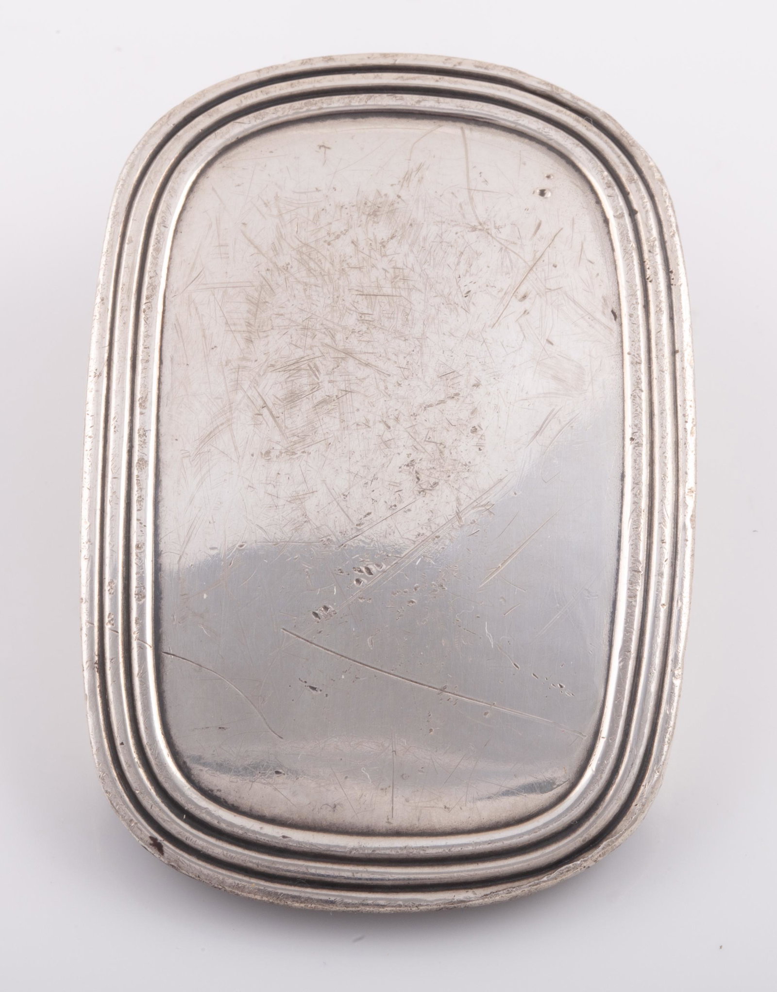 TIFFANY STERLING BELT BUCKLE: Rounded rectangle buckle with ribbed border, signed Tiffany & Co, stamped Sterling, L-2", .90 ozt; some surface scratches and wear, G-G+