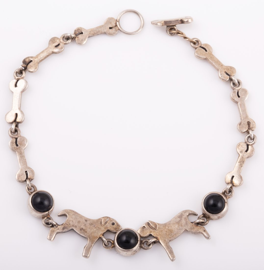 STERLING DOG BRACELET: Dog Bone Chain with 3) Bezel set black cabochon stones; .32 ozt total L - 7 1/2" G - VG