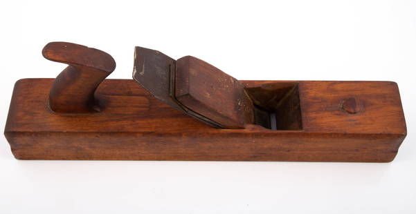 EARLY WOODEN BLOCK PLANE: Hand hewn wood handle, wood has nice patina; flaked wood grain on sides of plane; overall L-16", width 2 1/2"; VG