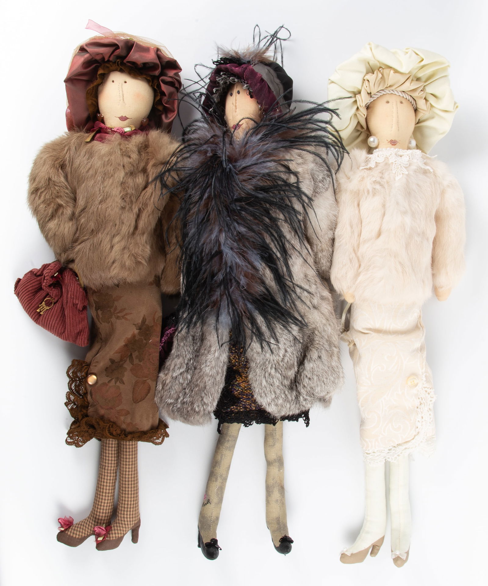 (3) CARMAN MANAGO DOLLS with ORIGINAL BOXES: (1) lady wearing brown fur coat; (1) lady wearing white fur coat; (1) lady wearing gray fur coat; cloth dolls with painted faces; signed on leg; (1) box has a stain on top; L-23 1/2", EX-NM