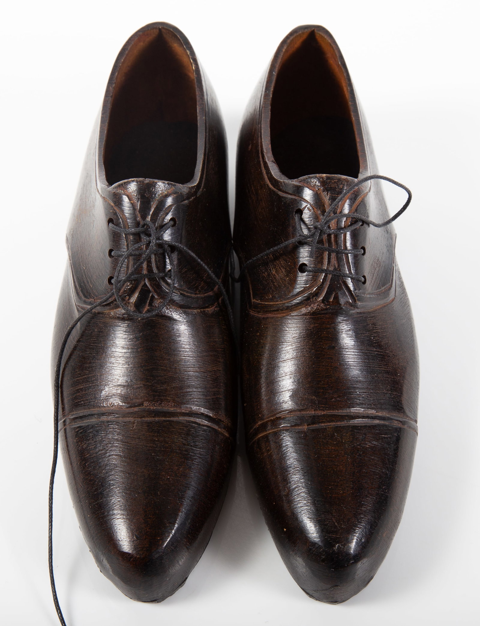 PAIR OF MINIATURE BRONZE SHOES: Unusual pair of bronze / metal shoes, rubber soles and interior lining, string laces; unsigned, L-6", EX