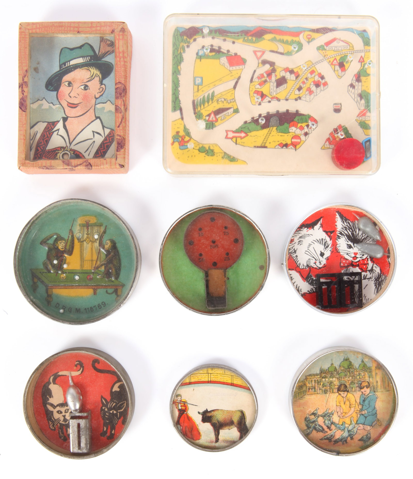 (8) ANTIQUE DEXTERITY PUZZLES / POCKET MIRRORS: Mostly German, includes: (2) cat and mouse themed, 1-with pocket mirror backing; (1) feeding pigeons with pocket mirror, (1) bull fight image pocket mirror; (1) ball game, rim stamped DGRM Germany wit