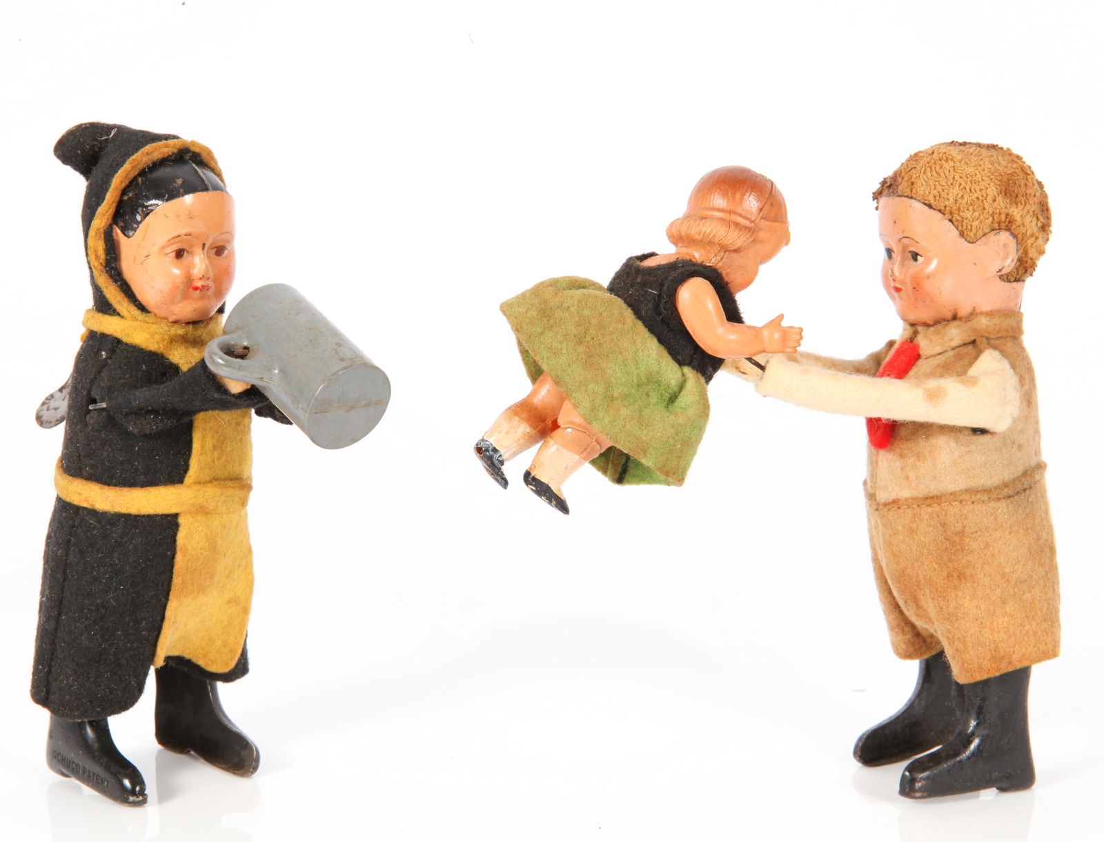 SCHUCO TYROLIAN DANCING COUPLE & DRINKING MONK: Includes: (1) Schuco Tyrolian Dancing Couple; Painted metal figure with felt clothing, dancing with celluloid body girl; male figure lacking hat; felt clothing has fading and soiling; some paint loss