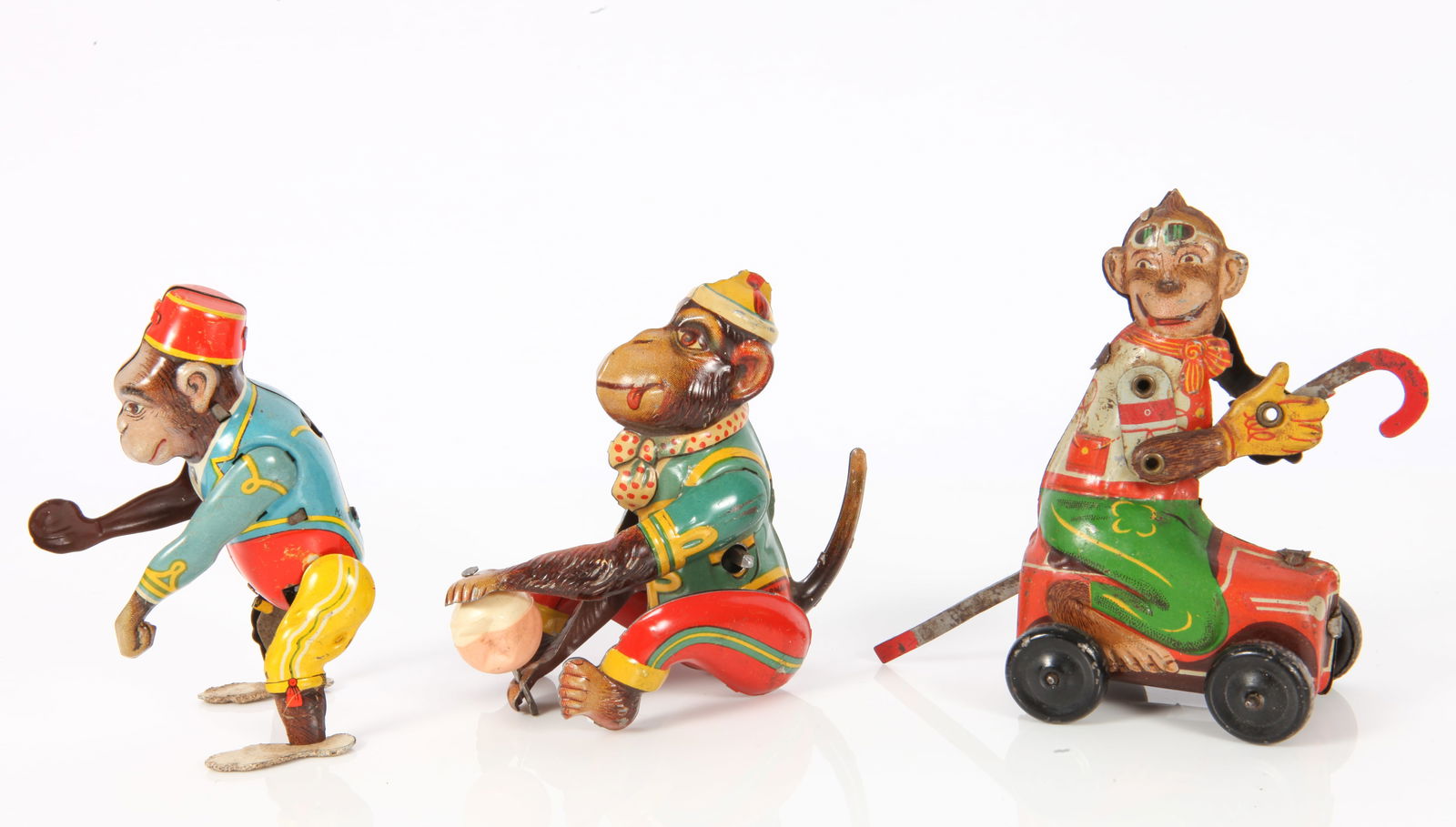 (3) GERMAN TIN MONKEY WIND-UP TOYS - KOHLER & HOEFLER: Includes: (1) U.S. Zone Germany Kohler acrobatic monkey, tin litho, celluloid ball is dented, some minor rubs and litho scrapes, working, no key; L-4 3/8" (legs down); (1) rare Hoefler tin litho monke