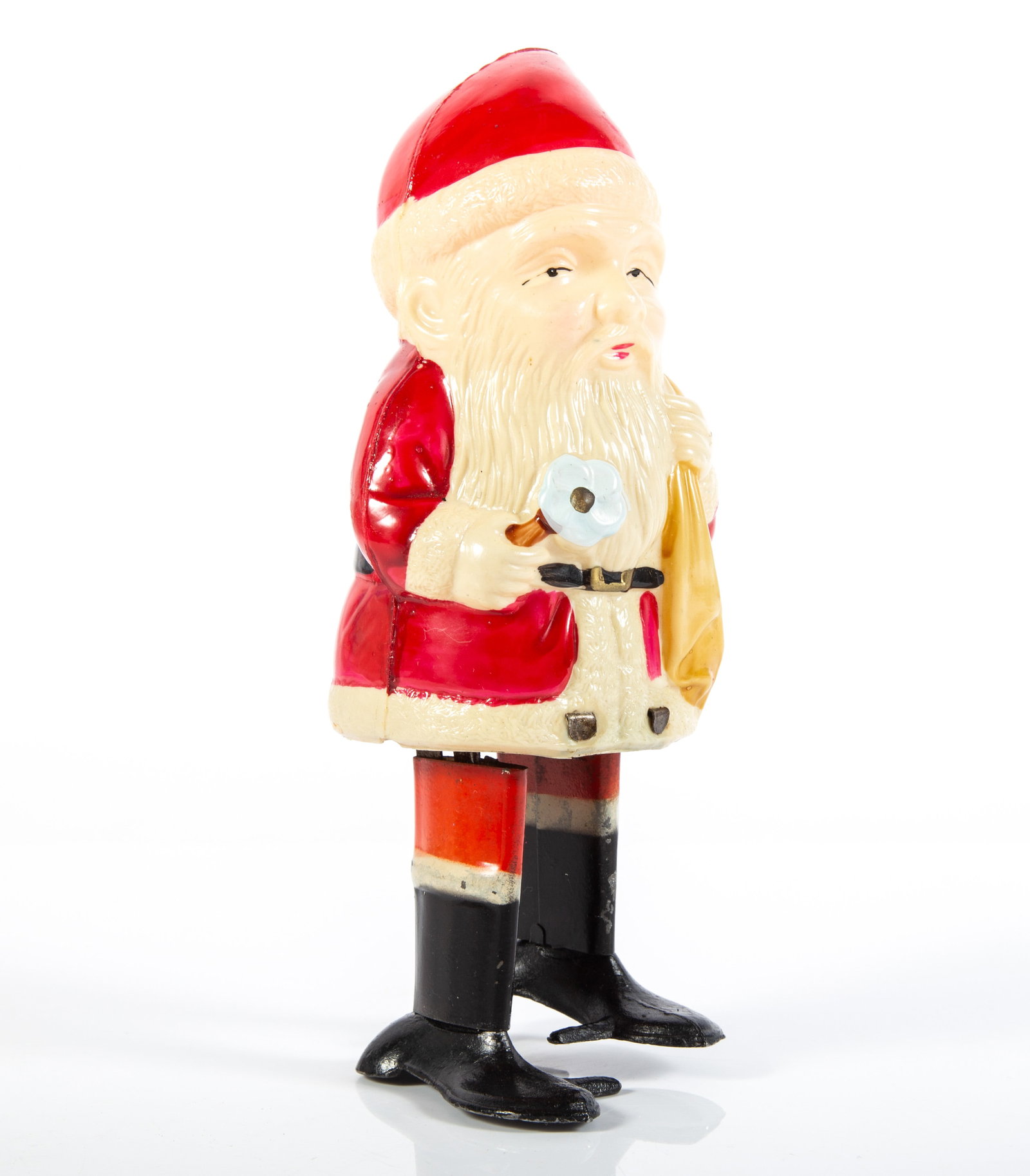 CELLULOID SANTA with PACK - OCCUPIED JAPAN, LEAD FEET WIND-UP: Celluloid walking Santa, clockwork mechanism, colorful Santa with tin legs and lead feet; wind-up mechanism works well, legs slightly out of kilter (Santa tends to want to fall over); no key; some chi