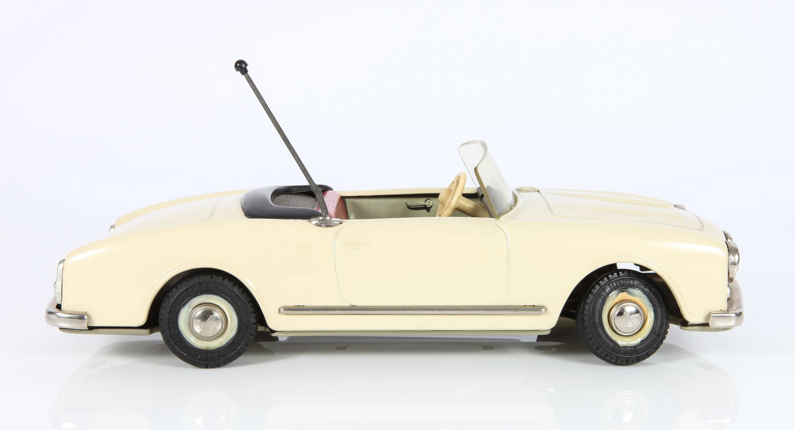 SCHUCO MAGICO 2010 ALFA ROMEO: Painted metal; wind up working; missing external steering mechanism and original key; painted surfaces have very minor wear and rubs; passenger side front wheel hub is disfigured, brightwork is very c