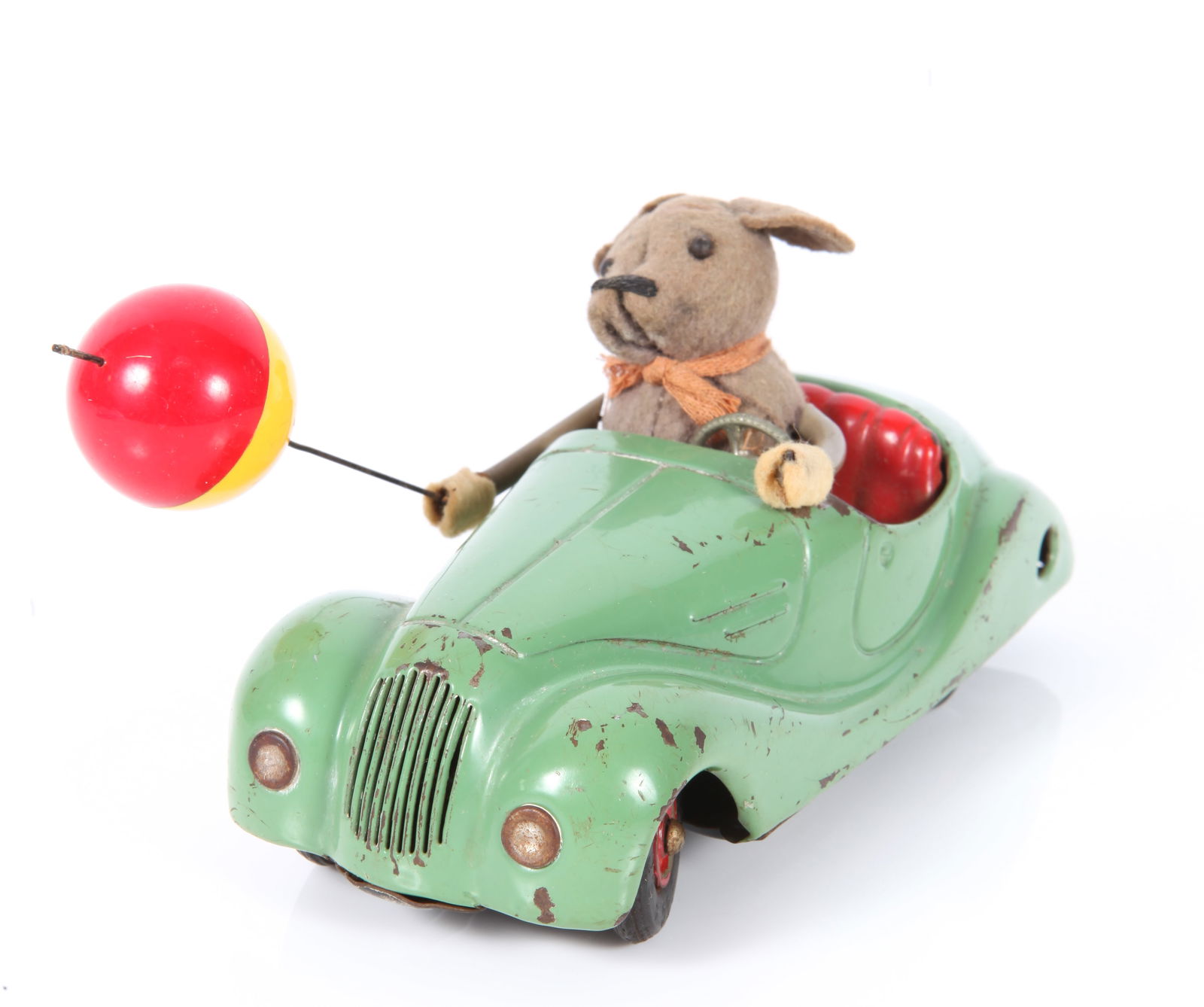 SCHUCO SONNY 2005 MOUSE CAR with BALLOON: Painted metal coupe, featuring felt mouse driver with red and yellow plastic ballon, bottom marked "Made in US Zone Germany", felt character has some wear, especially to hands; car has paint loss and