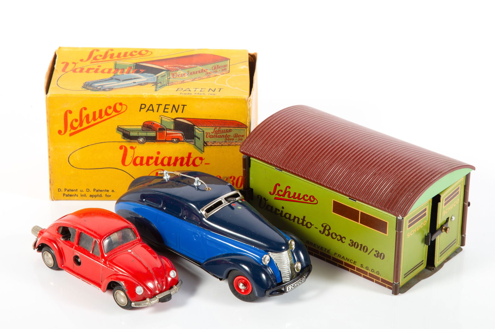 (3) SCHUCO VEHICLES - VW MICRORACER, VARIANTO GARAGE, RADIO 5000: (1) Volkswagen Beetle Microracer #1046, key wind, mechanism seems to work, some paint chips, mostly to front right fender edge, edge wear and slight scratches, L-4 1/4"; (1) Schuco Radio 5000, music b