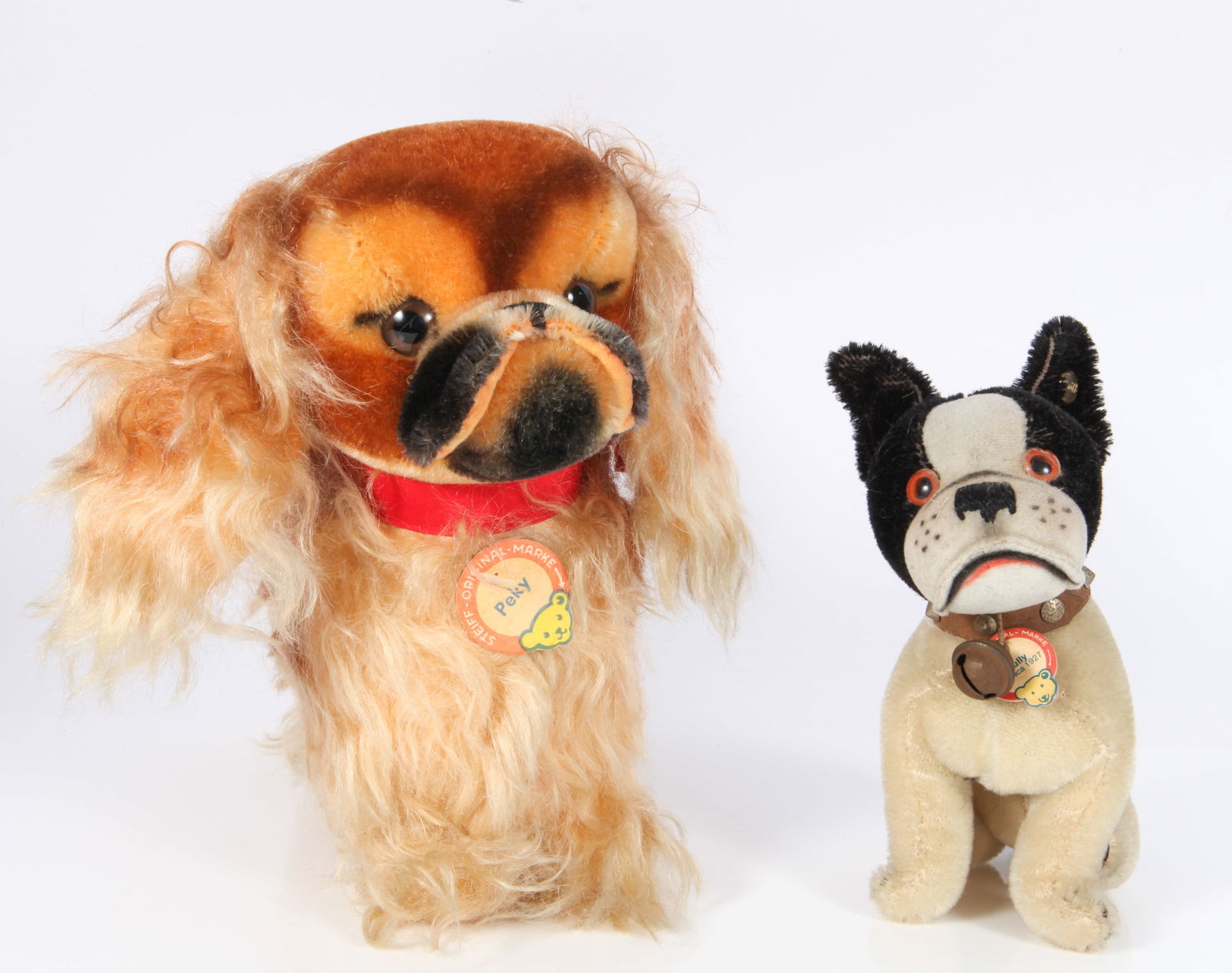 (2) VINTAGE STEIFF DOG ANIMALS - MOHAIR: (1) "Peky" Pekingese dog, original chest tag and ear button, yellow tag; (1) "Bully" Bulldog, "Replica 1927"; original chest tag and ear button, rust on collar and bell; overall minor wear; H-7"-9"; G