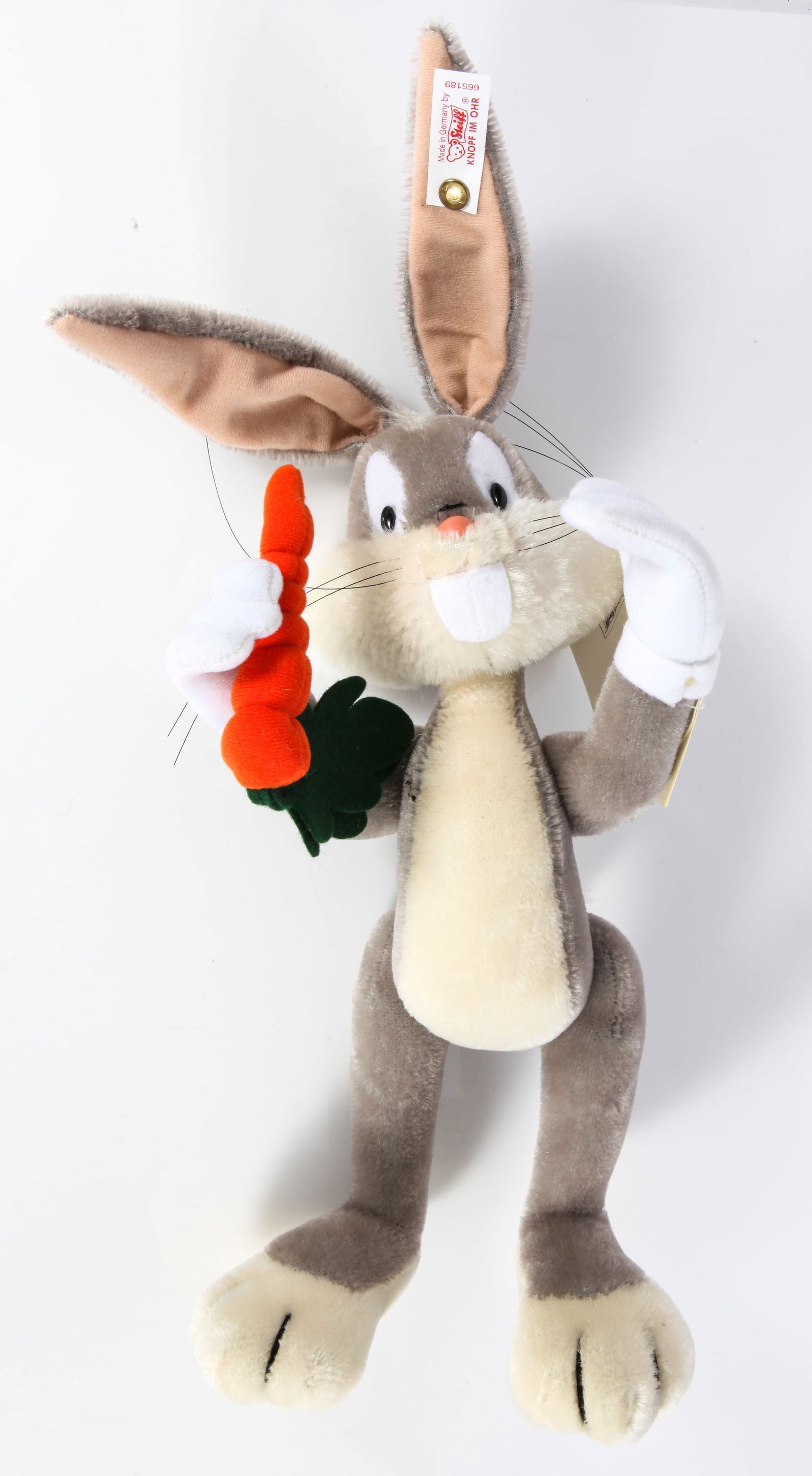 STEIFF BUGS BUNNY: Limited edition of 2500; mohair; white ear tag and button; original tags on arm; never played with; retail price in Warner Bros. catalog was $300; L-12", EX-NM