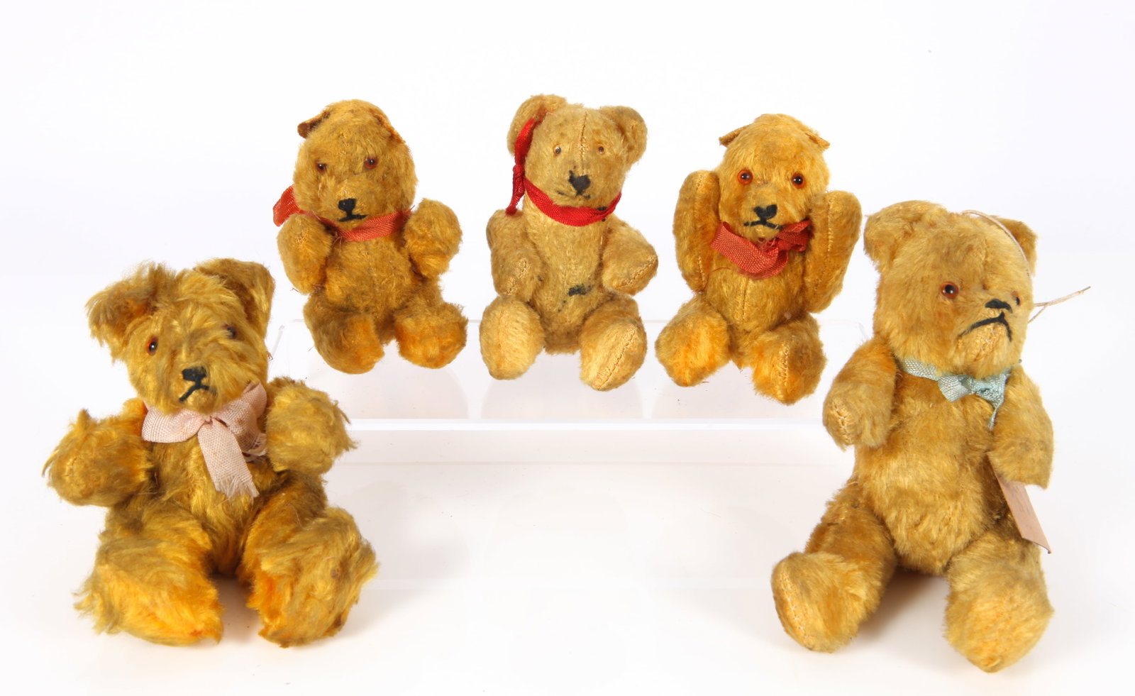 (5) ANTIQUE MINIATURE MOHAIR BEARS: Jointed, glass eyes; normal wear; (1) stain on stomach; L-3 1/2" - 5 1/2", G-VG