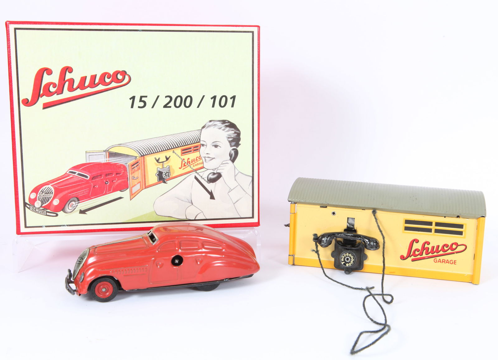 VINTAGE SCHUCO AUTO LIMOUSINE & GARAGE TOY - ORIGINAL BOX: Together with reproduction box, includes: (2) tin-plate key wind cars: 10 1250 U. S. Zone Germany, 1)1750 made in Germany, not working; (1) 1500 Garage, made in Germany with spare parts; original box