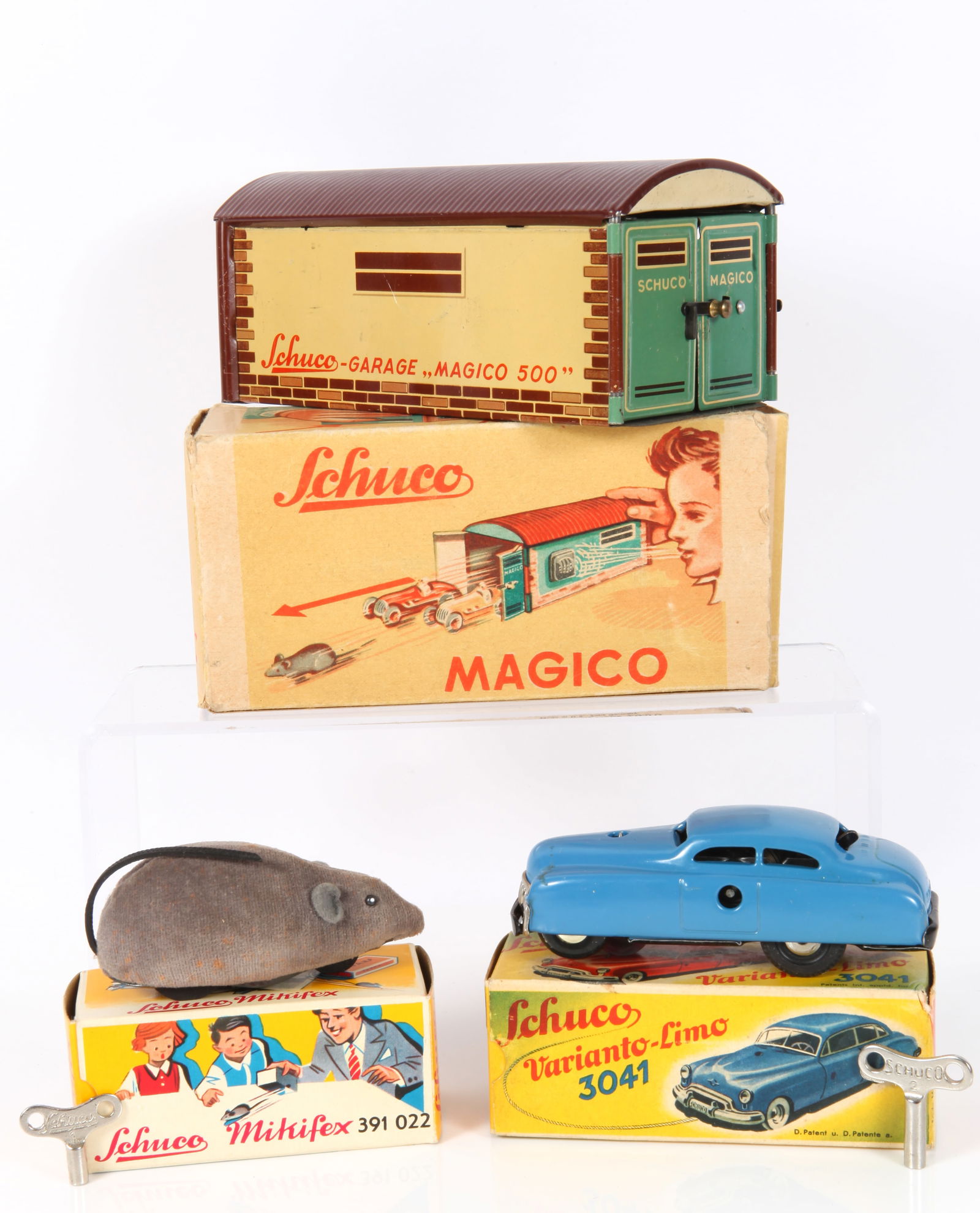 (3) SCHUCOS: MAGICO, VARIANTO-LIMO & MIKIFEX: Includes: (1) Schuco Minifex [391022], made in Western Germany, original box, velvet covered tin with rubber tail, retains original key, works, some minor discoloration, box L-3 1/2"; VG+; (1) Schuco