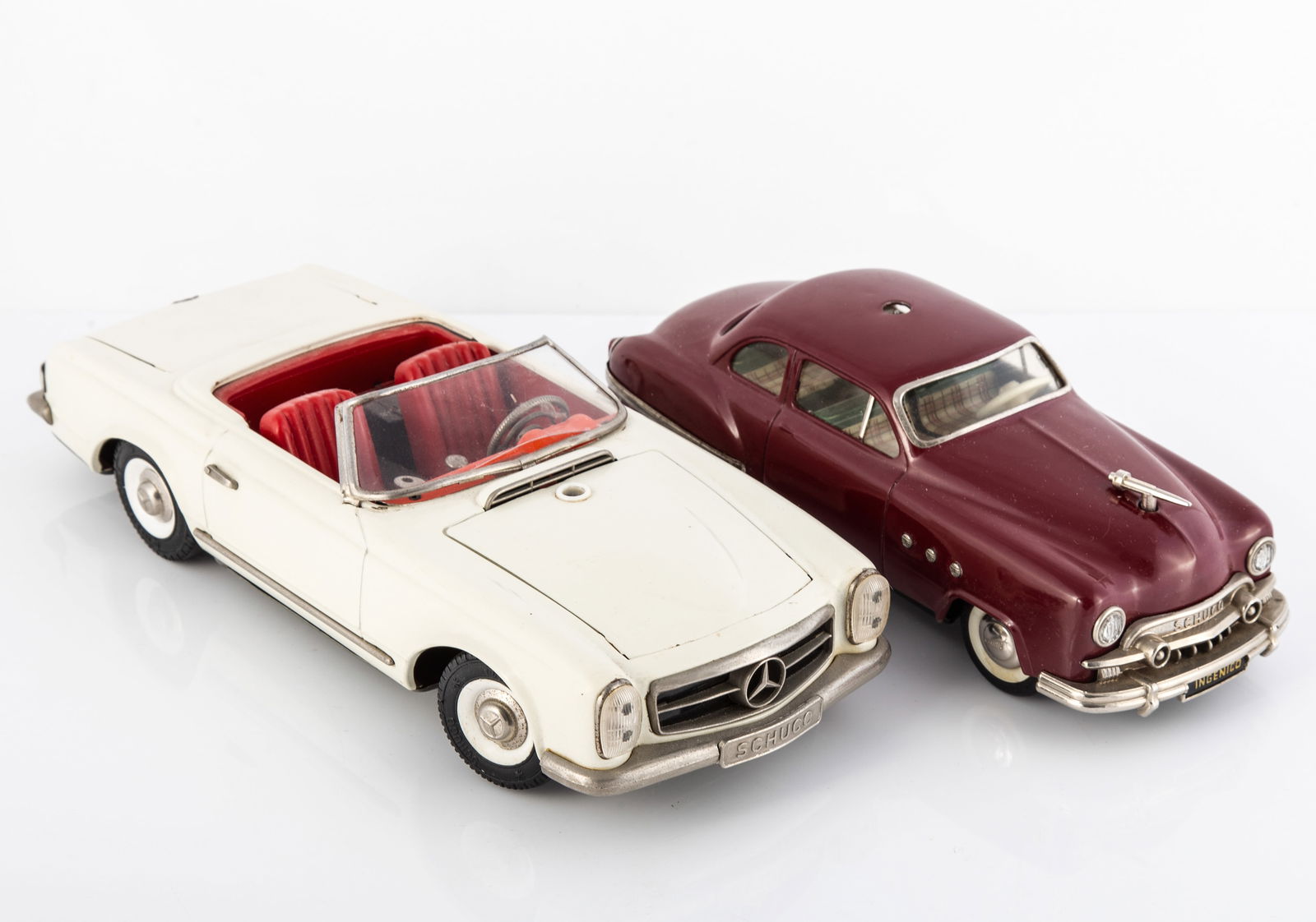 (2) SCHUCO INGENICO 5311 SEDAN & "REAL" 5500 MERCEDES 230 SL: (1) Made in US Zone Germany; painted tin exterior; litho tin interior; made to work with external battery / external steering wheel (not present); steering articulated via the hood ornament; car is un