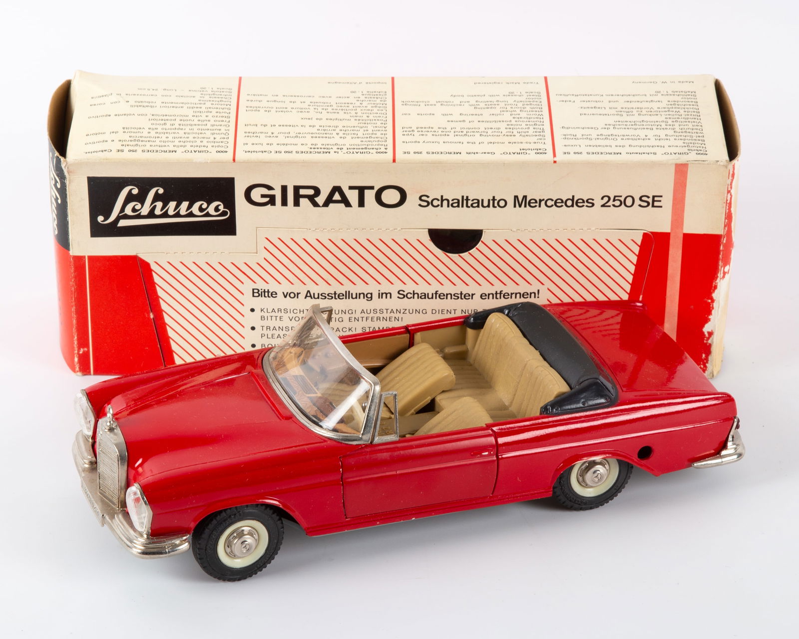 SCHUCO GIRATO 4000 MERCEDES 250SE with ORIGINAL BOX: Schuco Mercedes 250SE clockwork auto, shifts gears, steering wheel steers; painted tinplate exterior with tin litho interior; retains original key; original display box significant paper surface loss