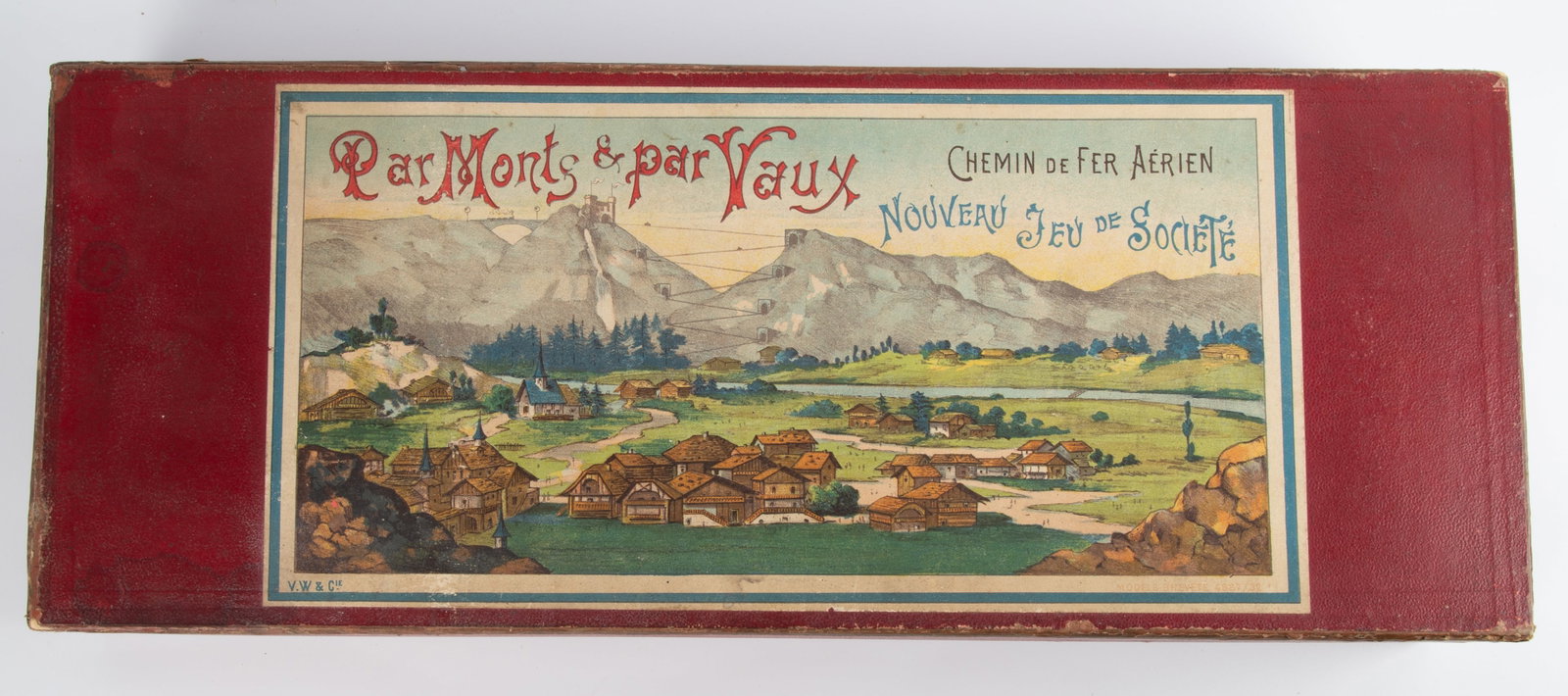 FRENCH PAR MONTS & PAR VAUX GAME: Appears complete; V. W. & Co., retains tin litho car, trolley / marble game, original hinged wood box with red covering, colorful paper litho label; 24" x 9 1/2" x 4 1/2", VG