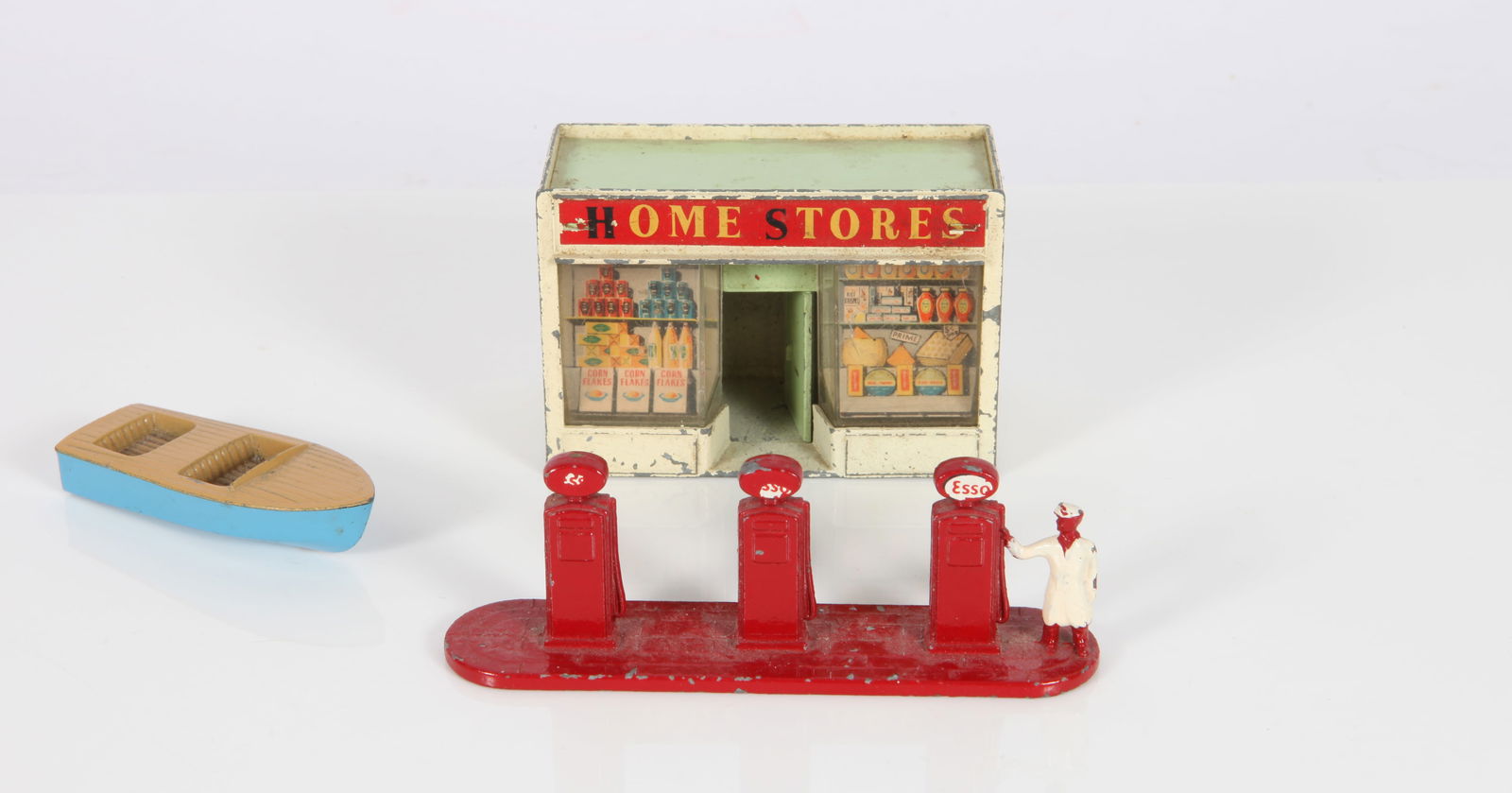 (3) VINTAGE LESNEY TOYS: Painted die-cast England; (1)Matchbox shop, Homestores / building; (1) ESSO gas pumps< (1) Meteor Sportsman MK II, No. 48' boat; shop and gas pumps have minor paint loss; L-2 3/8 - 3 3/4", G-VG