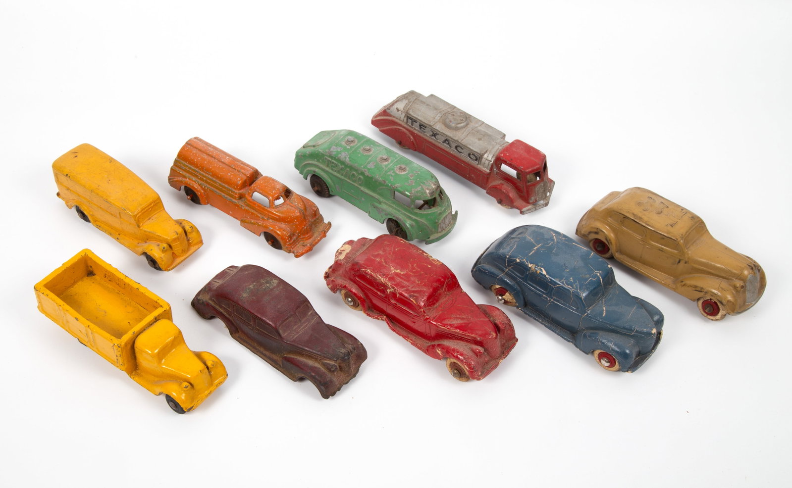(9) VINTAGE TOY CARS & TRUCKS: (3) painted metal, USA; (1) Kiddie-Toy Hubley Texaco truck; paint loss; wheels deteriorating; (1) Tootsieoty Texaco truck, minor loss, wheels crazed; (1) Manoil truck #710, paint loss, spotty; (6) rub