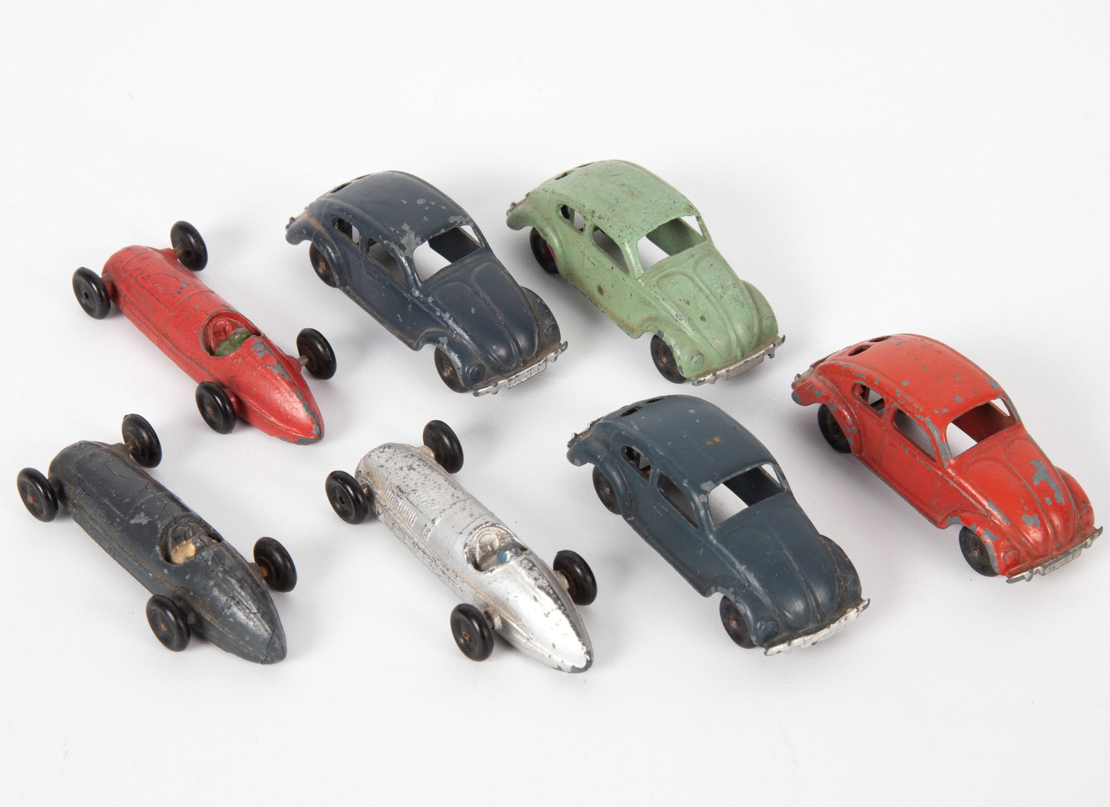 MARKLIN PICO 9 VW BEETLE and 61 MERCEDES RACER (7): Slush metal with solid rubber tires; (4) Pico 9 Volkswagen Beetles, 2-blue, 1-green, 1-red; (3) Pico 61 Mercedes race cars; all with moderate paint chips and wear; L-2 1/4"+/-, G-G+