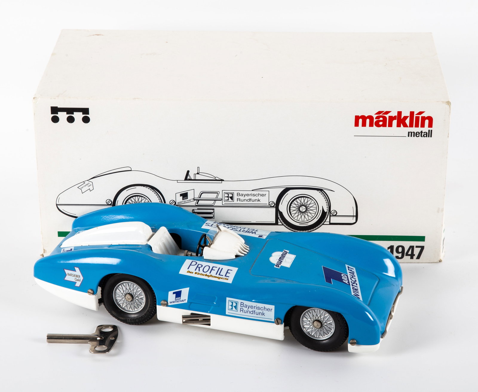 MARKLIN #1947 MERCEDES W196 with ORIGINAL BOX: Painted metal with decals; clockwork mechanism; streamline full body race car; works well; retains original key; slight discoloration to white paint around keyhole; box 14 1/2" x 7 1/4" x 6 3/4", EX
