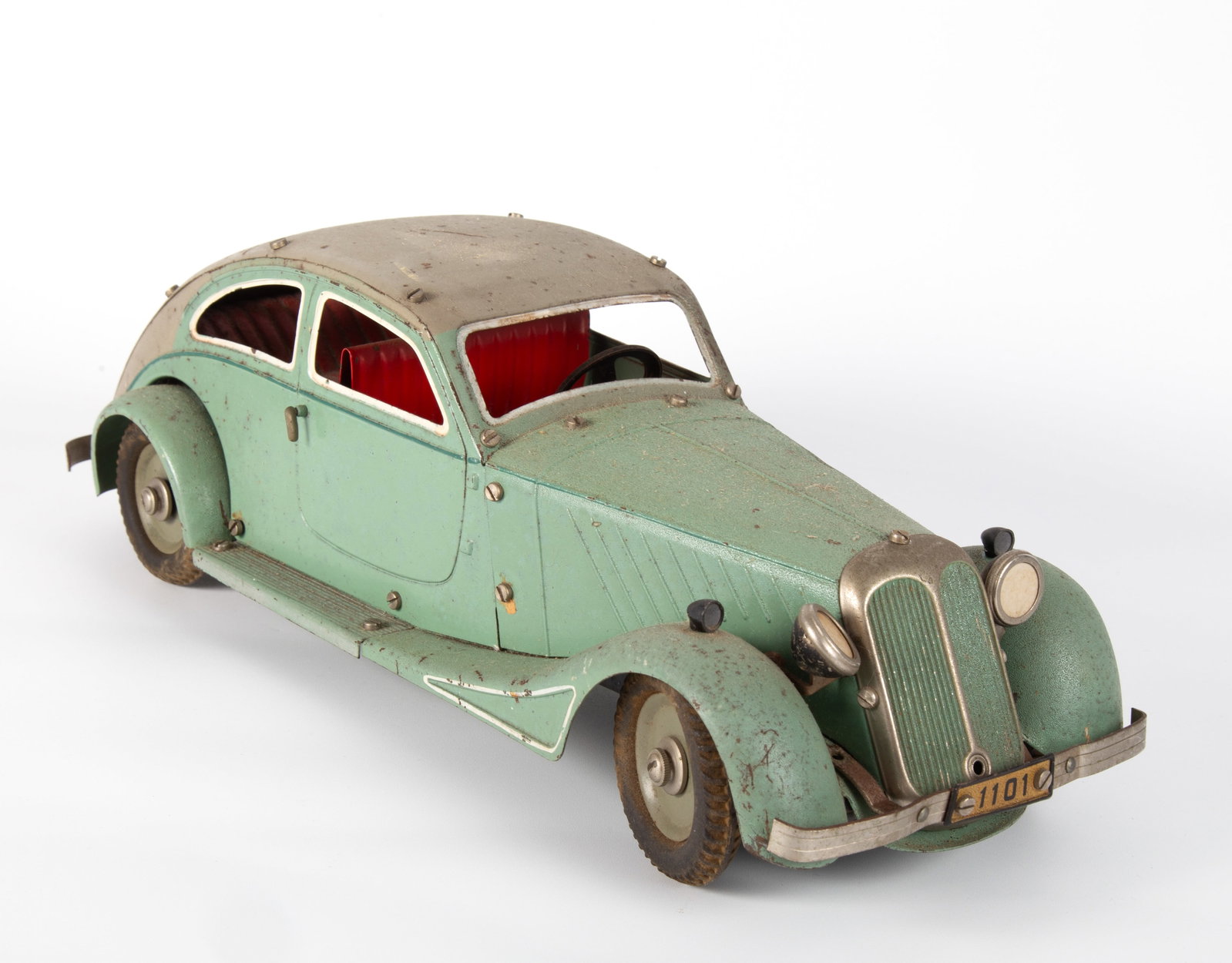 GEBRUDER MARKLIN SEDAN KIT CAR: Wind-up mechanism is not present; missing a few screws; body has surface oxidation; slight dent to roof of car; L-14 1/4", F