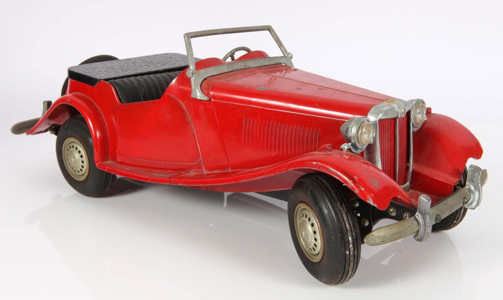 VINTAGE DOEPKE MG CAR MODEL TOY: Painted pressed steel; 1950's; made by Model Toys; extra dashboard decal included; minor paint loss; dashboard decal has some loss but new decal included; windshield frame intact but no windshield; sc