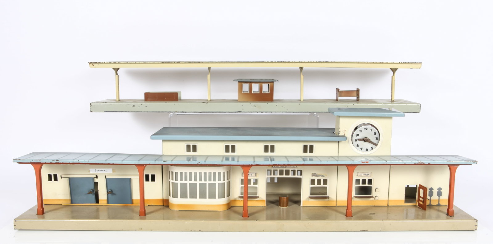 HO KIBRI TRAIN STATION & MARKLIN TRAIN STATION: Painted metal; (1) Kibri train station with wind-up clock (loose in housing); very minor edge wear and paint loss; missing one window label; very detailed with opening and closing doors; roofs lift of