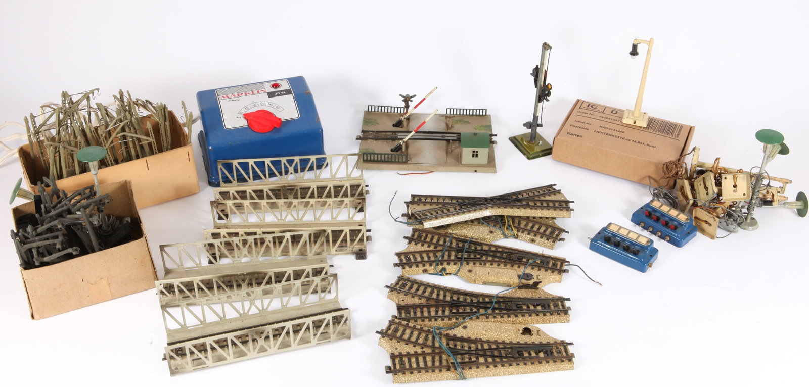 VINTAGE HO MARKLIN LIGHTS, SIGNALS, TRANSFORMERS, TRACK & ACCESSORIES: Includes: #6153 110 volt transformer, original box; (34) #7009 Centenary Masts; (2) 3-rail truss bridges, (2) 2-rail truss bridge, (1) 3-rail truss bridge; (2) #3801 MWR, (1) #3801 MWR, (1) #5114 cros