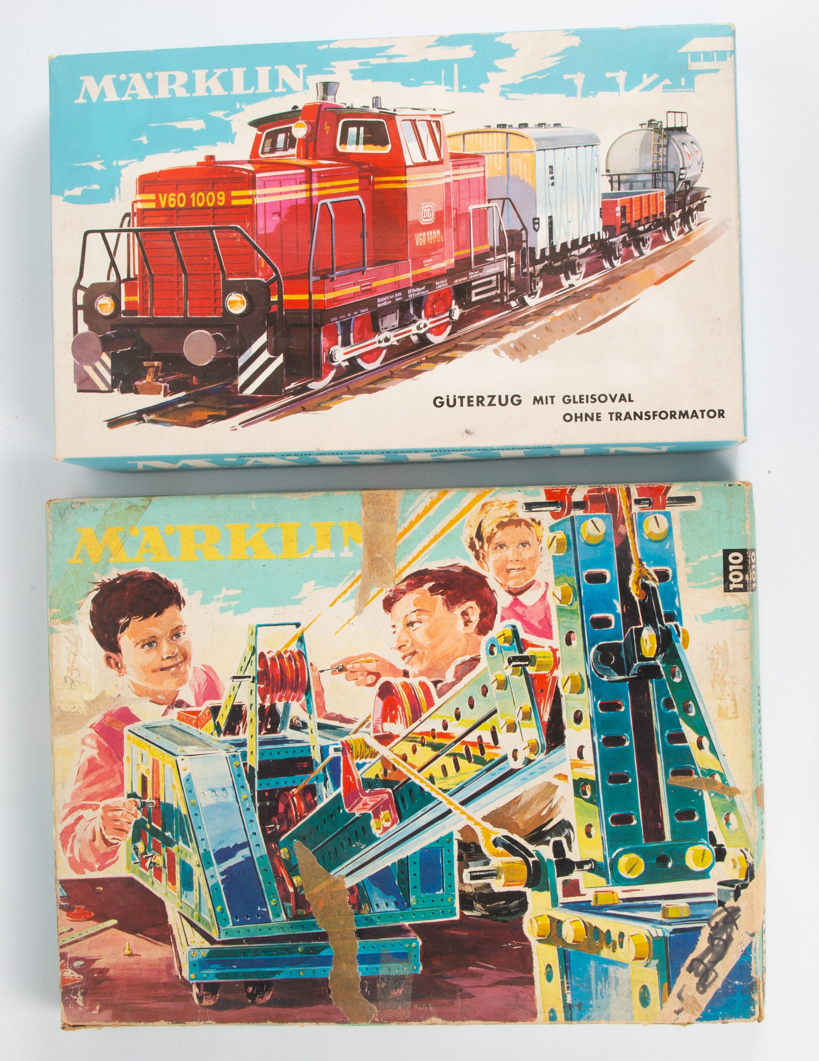 (2) VINTAGE MARKLIN TRAIN SETS - ORIGINAL BOXES: (1) partial HO train set #3264, includes original box, owner's manual and (4) train cars (plastic and metal); missing engine and track; (1) basic metal building set #1010, appears to be mostly complet