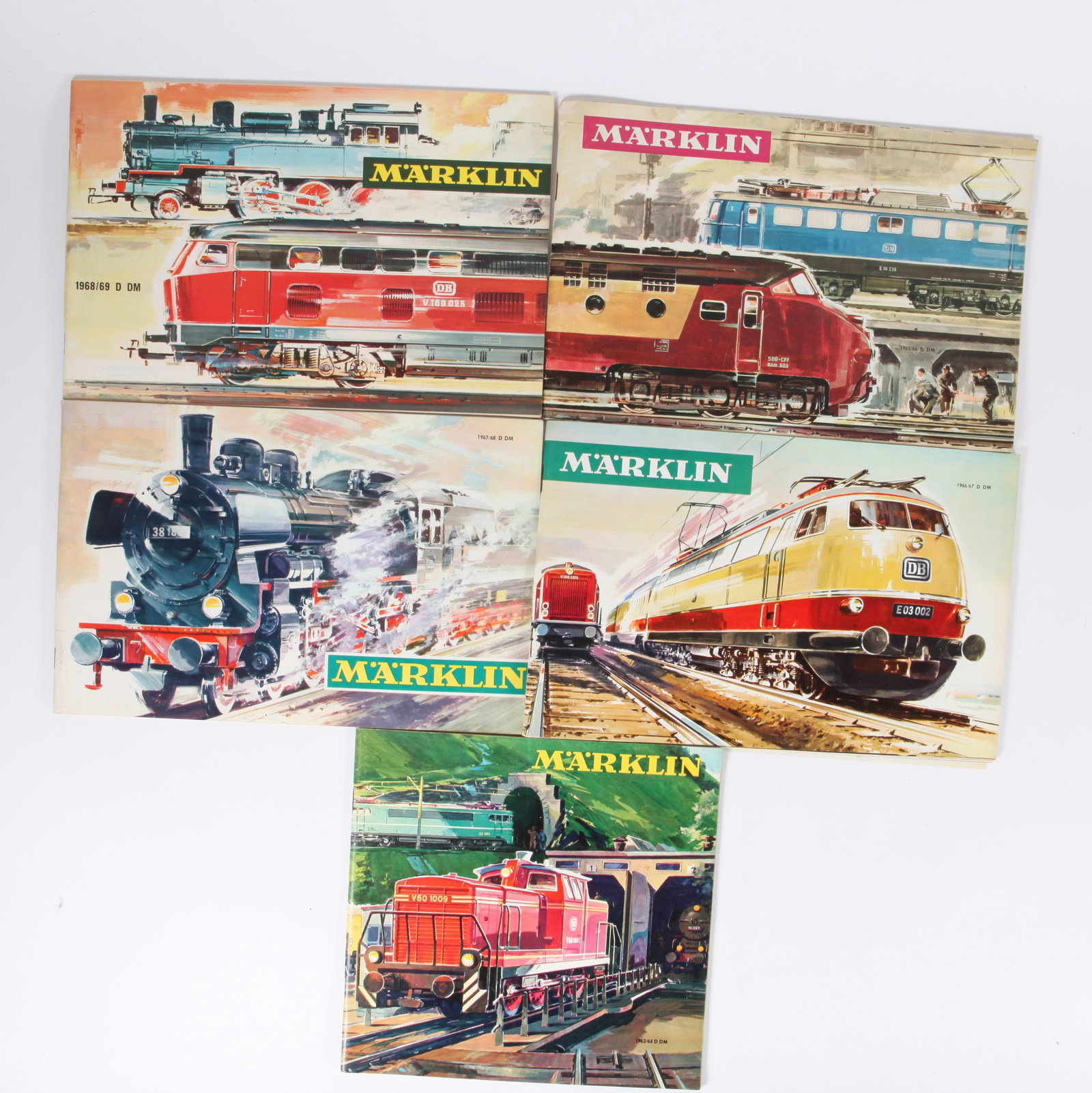(5) VINTAGE MARKLIN TRAIN CATALOGS: (1) 1963/1964 D DM, (1) 1965/1966 D DM; (1) 1966/1967 D DM, (1) 1967/1968 D DM, (1) 1968/1969 D DM; (4) 10 1/2" X 7", (1`) 8" X 8", VG-EX