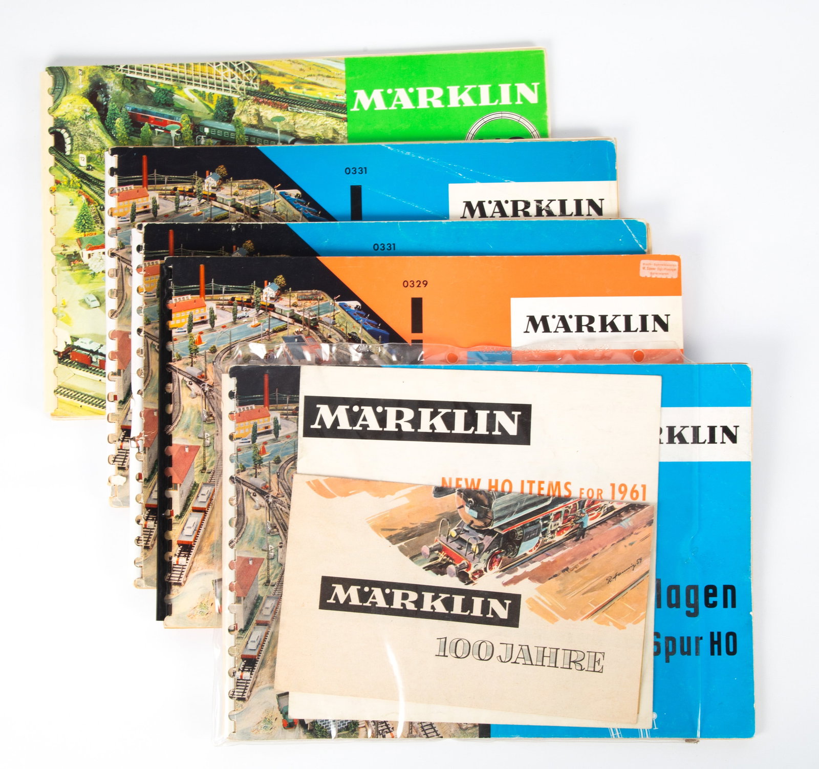 VINTAGE MARKLIN TRACK PLANS, BROCHURES, CATALOGS: HO Scale, 1960's; (5) track plans: (1) 330, (1) 329, (2) 331, (1) 350; (1) "New HO Items for 1961" brochure, (1) Marklin 100 Jahre brochure; normal wear; minor losses; largest 12" x 8 1/2" G-VG