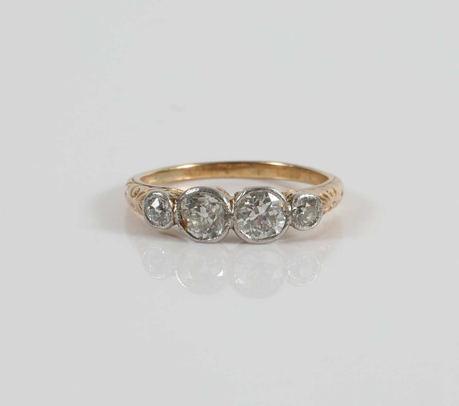 14K GOLD & DIAMOND RING: 14K yellow gold setting with (2) .25 carat+/- round diamonds and (2) .10 carat +/- round diamonds; [1.4 dwt total], size 6, G-VG