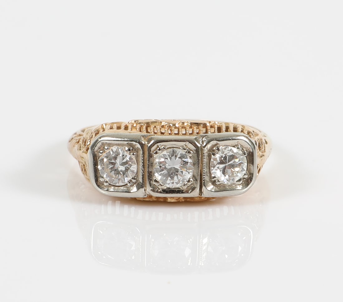 DIAMOND RING: Unmarked (tests 14K) yellow gold set with three .25+/- carat round diamonds; [1.1 dwt total], size 7.5, VG-EX