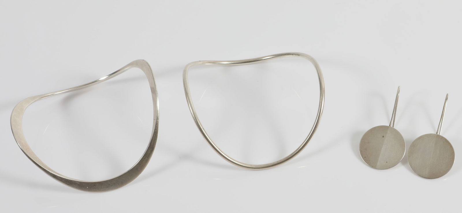BETTY COOKE SIGNED STERLING EARRINGS & (2) WAVE BANGLES: All pieces stamped Cooke and marked sterling; (1) pair disc form sterling earrings; French hook style pierced earrings, disc finished half brushed finish and half polished finish; disc Dia.-7/8", L-1