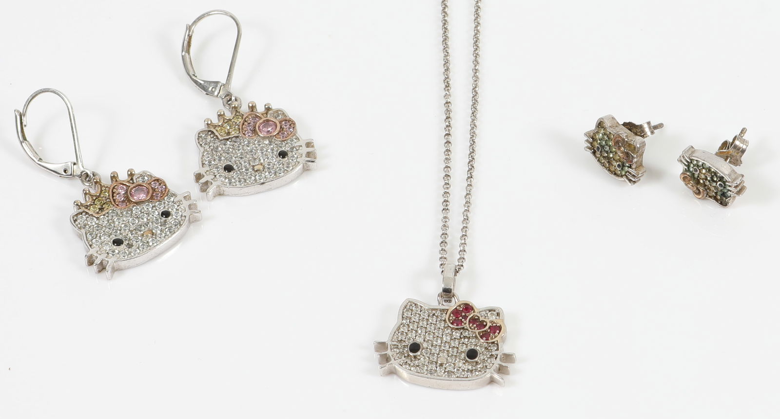 STERLING "HELLO KITTY" JEWELRY: (1) chain necklace with drop, L-18", .23 ozt; (1) dangle pierced earrings, L-1/2", .26 ozt; (1) stud pierced earrings, 1/4", .094 ozt; VG-EX