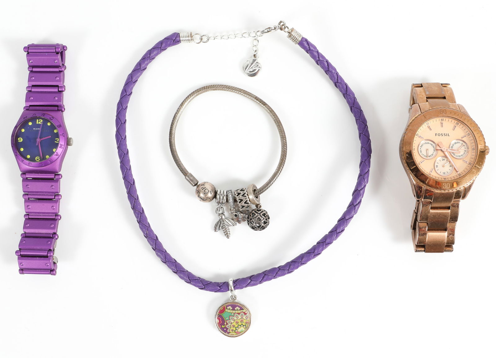 DESIGNER WATCHES & JEWELRY: (1) gold tone Fossil watch; (1) purple stainless Marc Jacobs watch; (1) Pandora bracelet with four charms; (1) Vera Bradley leather necklace; watches not running, likely need batteries; longest 16", V