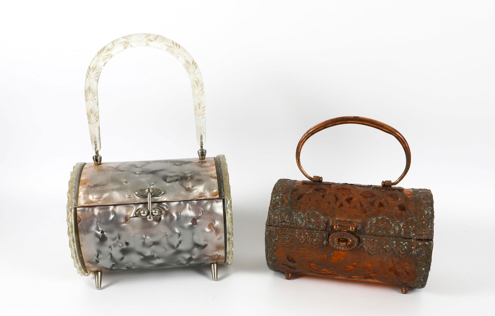 (2) VINTAGE BARREL PURSES: Hinged; (1) Walborg (Hong Kong) amber Plexiglas with copper overlay and copper handle; some verdigris and breaks in copper overlay on back and one side; (1) marbled gray over plexiglass, textured plex