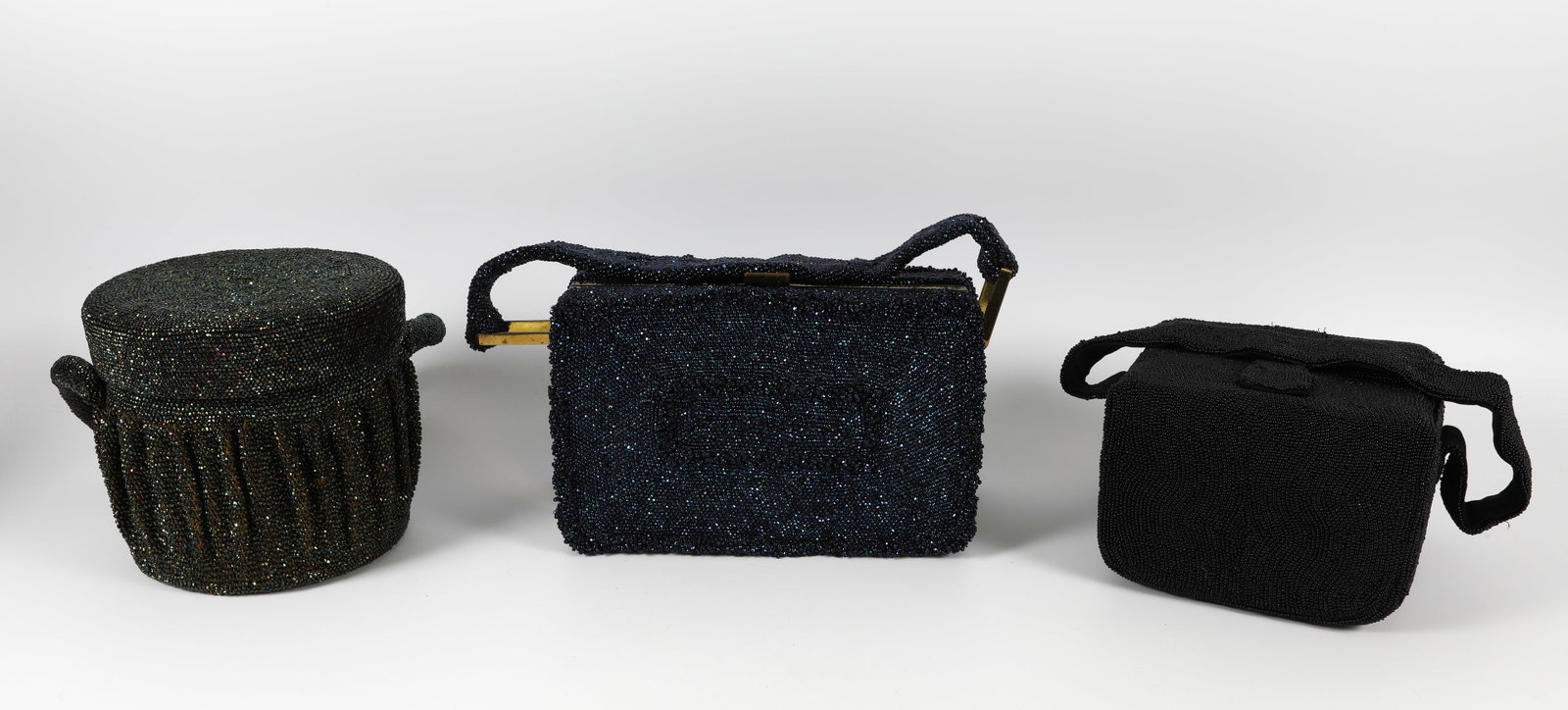 (3) BEADED VINTAGE PURSES: Lined; (1) black: double hinged top; minor bead loss; (1) deep blue: gold tone accent, hinged with clasp, divided compartments inside; (1) round deep green: mirror on interior lid, silvering loss; nee