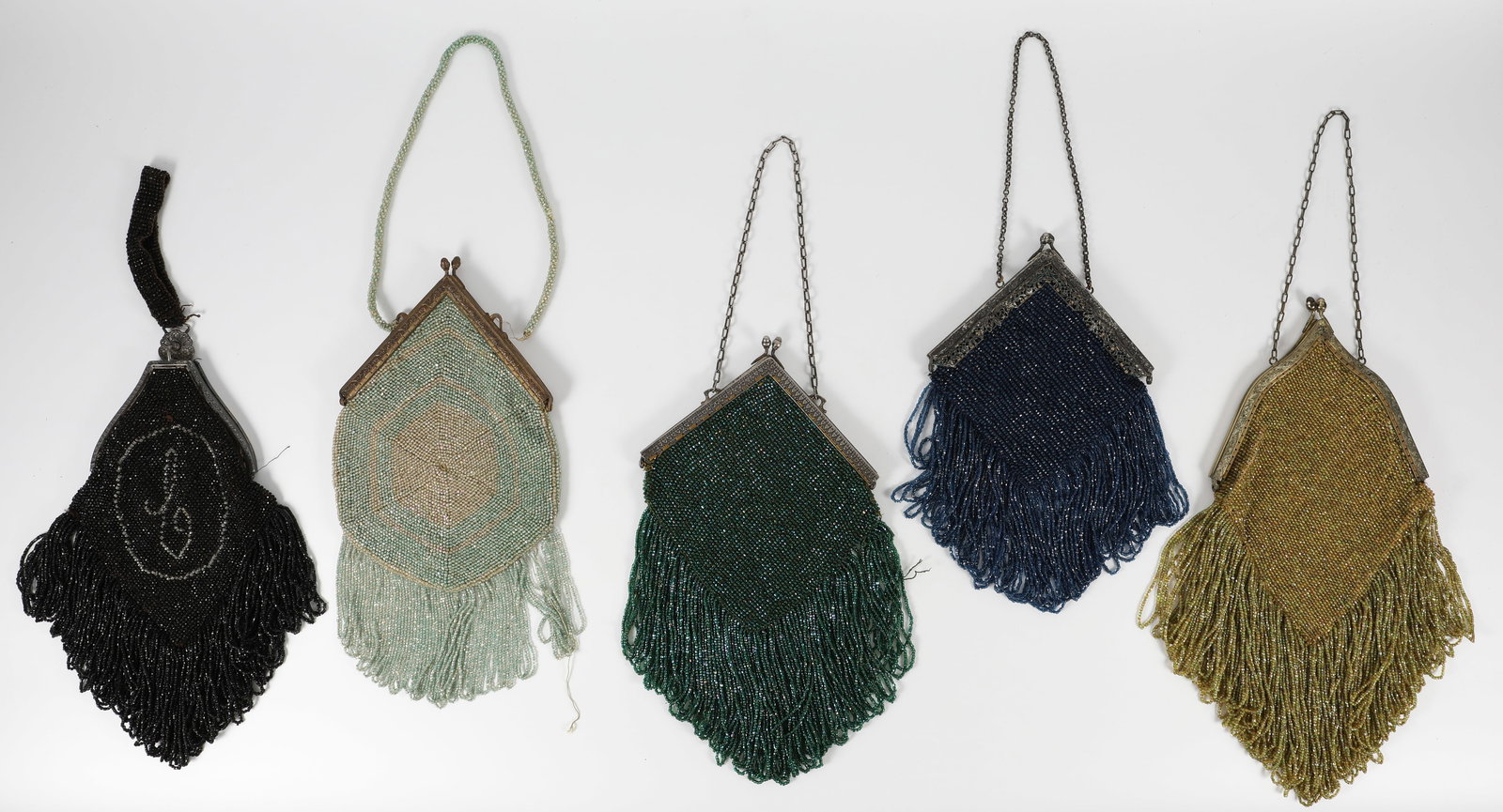 (5) VINTAGE BEADED HANDBAGS: Each bag fitted with chain handles; each with triangular metal frame / closure; includes: (1) green-ish gold beaded bag, silver tone floral motif frame / closure does not "snap" tightly; no lining; se