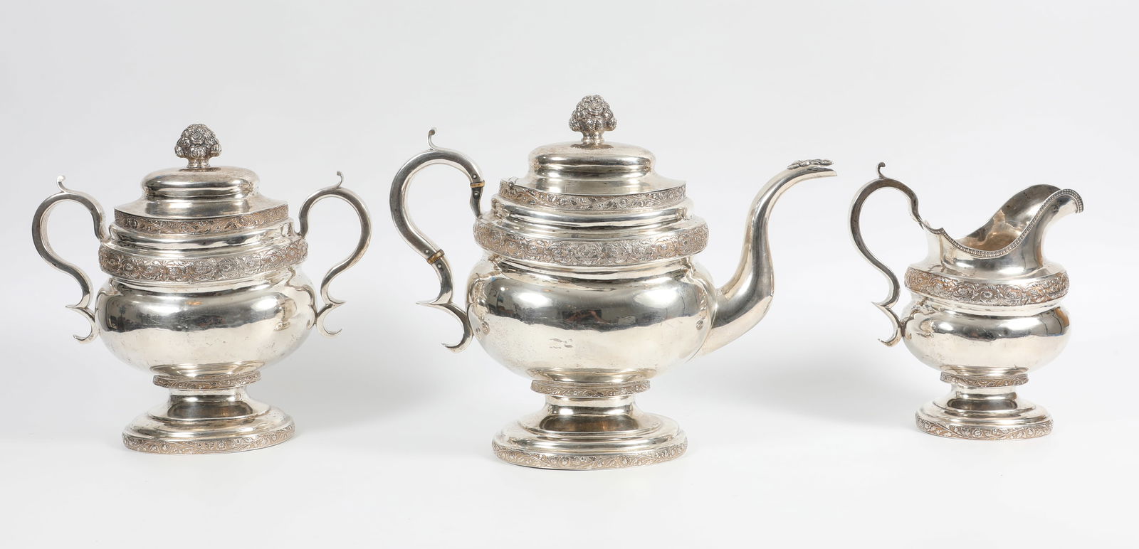 COIN SILVER (3) PCS. TEA SERVICE PB& C NEW YORK: Stamped on bottom: [ P. B. & C.] [N York], made by Maltby Pelletreau, John Bennett and D. C. Cooke which were silversmiths in New York from 1826-1828; ornate coin silver three piece tea service; (1) t