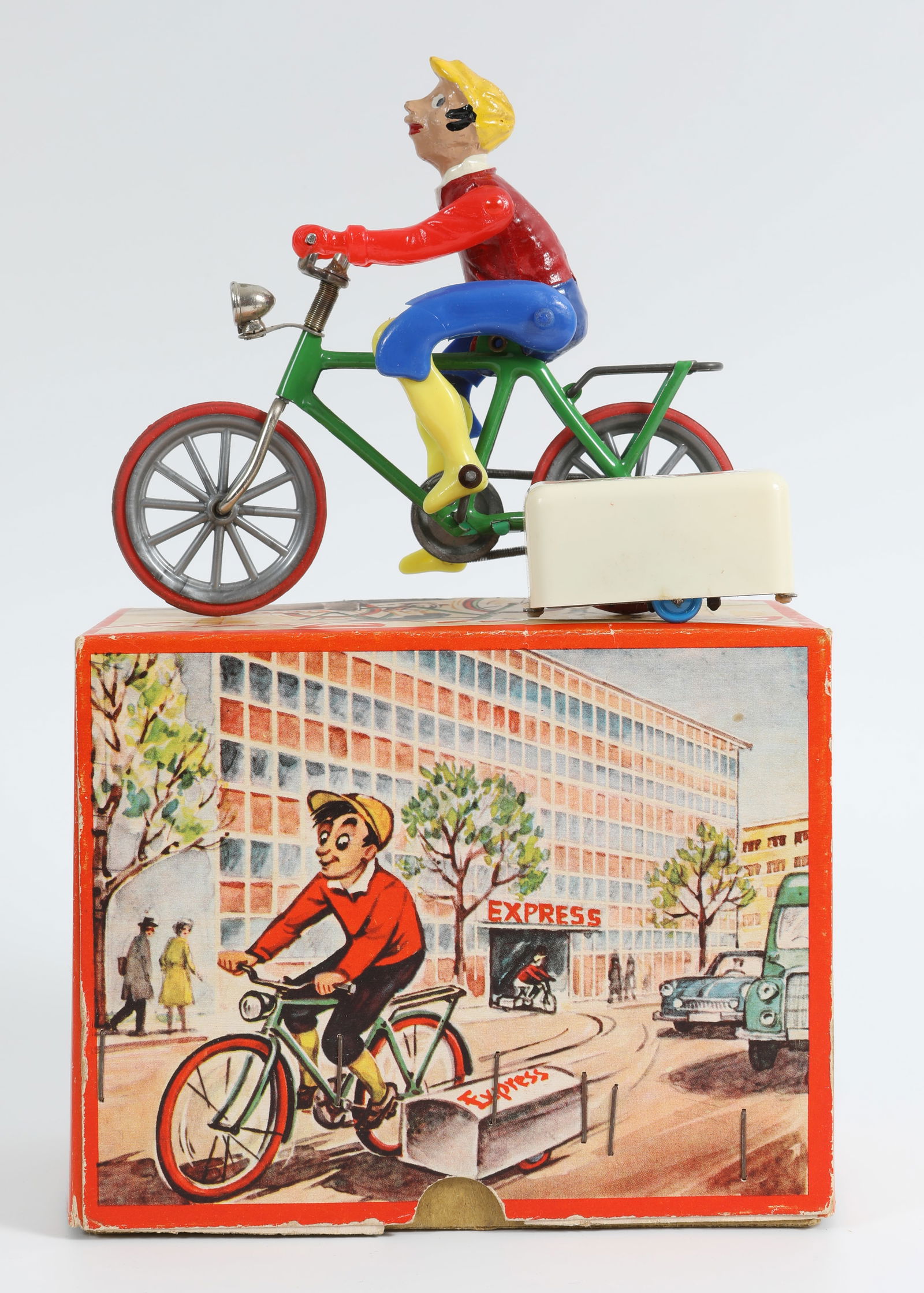 EXPRESS JONNY WIND-UP - ORIGINAL BOX: Made in Western Germany; "Express" bicyclist wind-up toy; working; both toy and box have very minor wear overall; box: 5 5/8" x 2 7/8" x 4 1/2, VG+