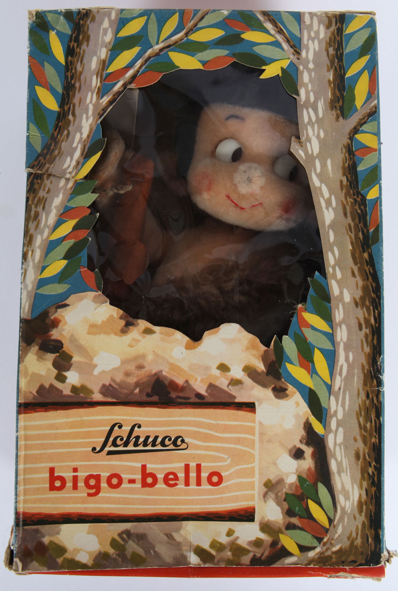 SCHUCO BIGO-BELLO SAMSON JR. with ORIGINAL BOX: Plush caveman with club, retains original hang tag; original display box has some minor tears and splits, dents and wear; one inner box lid flap is detached and stuck to lid; top lid has some abrasion