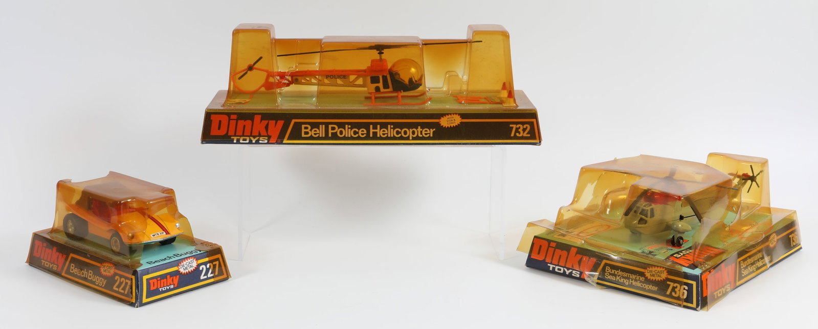 (3) VINTAGE DINKY TOYS: 227, 736, 732: In original packaging; packaging has yellowed and has losses to plastic; (1) Bell Police Helicopter #732; packaging intact; helicopter not removed from packaging; (1) Bundesmarine Sea King Helicopter 