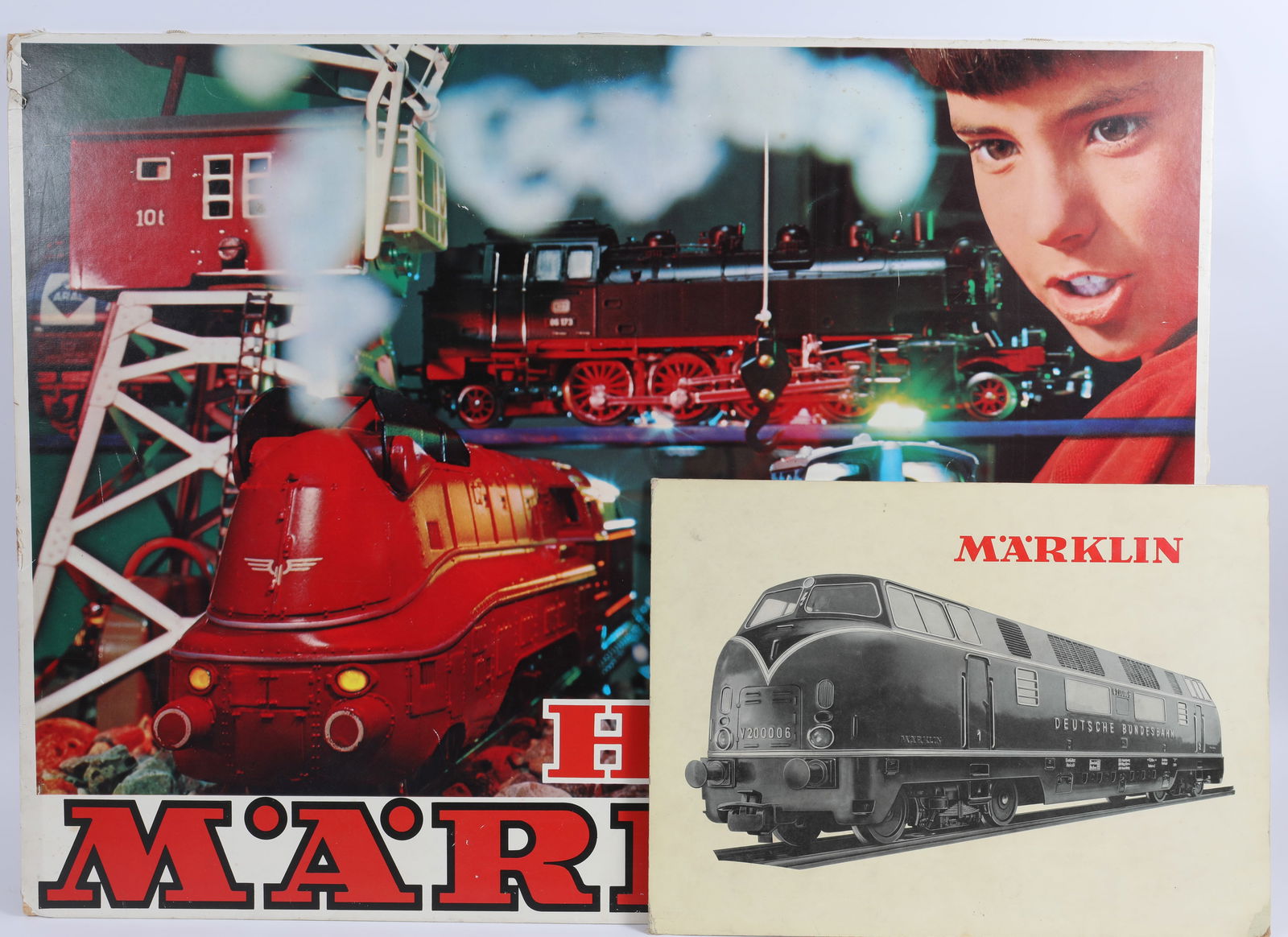 (2) VINTAGE MARKLIN ADVERTISING DISPLAYS: Litho cardboard with unused easel backs; (1) older, black and white printed V200006 Deutsche Bundesbahn train, corner bumps and wear; 11 1/2" x 16"; (1) 1970's vintage Marklin photo image "HO Marklin"