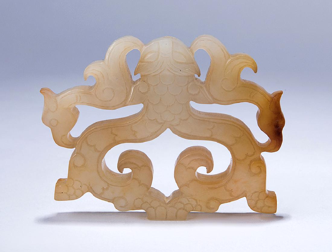 A WHITE JADE CARVING OF TWO 'DRAGON" (1 of 2)