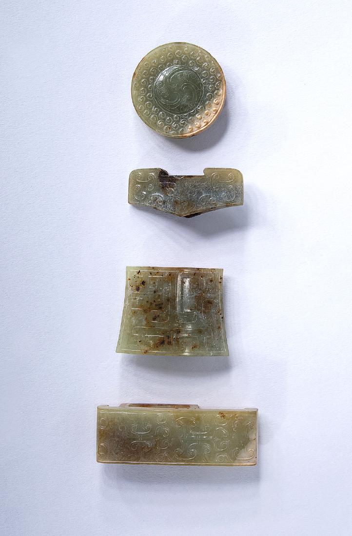 A RARE SET OF FOUR GREEN JADE SWORD FITTINGS (1 of 2)