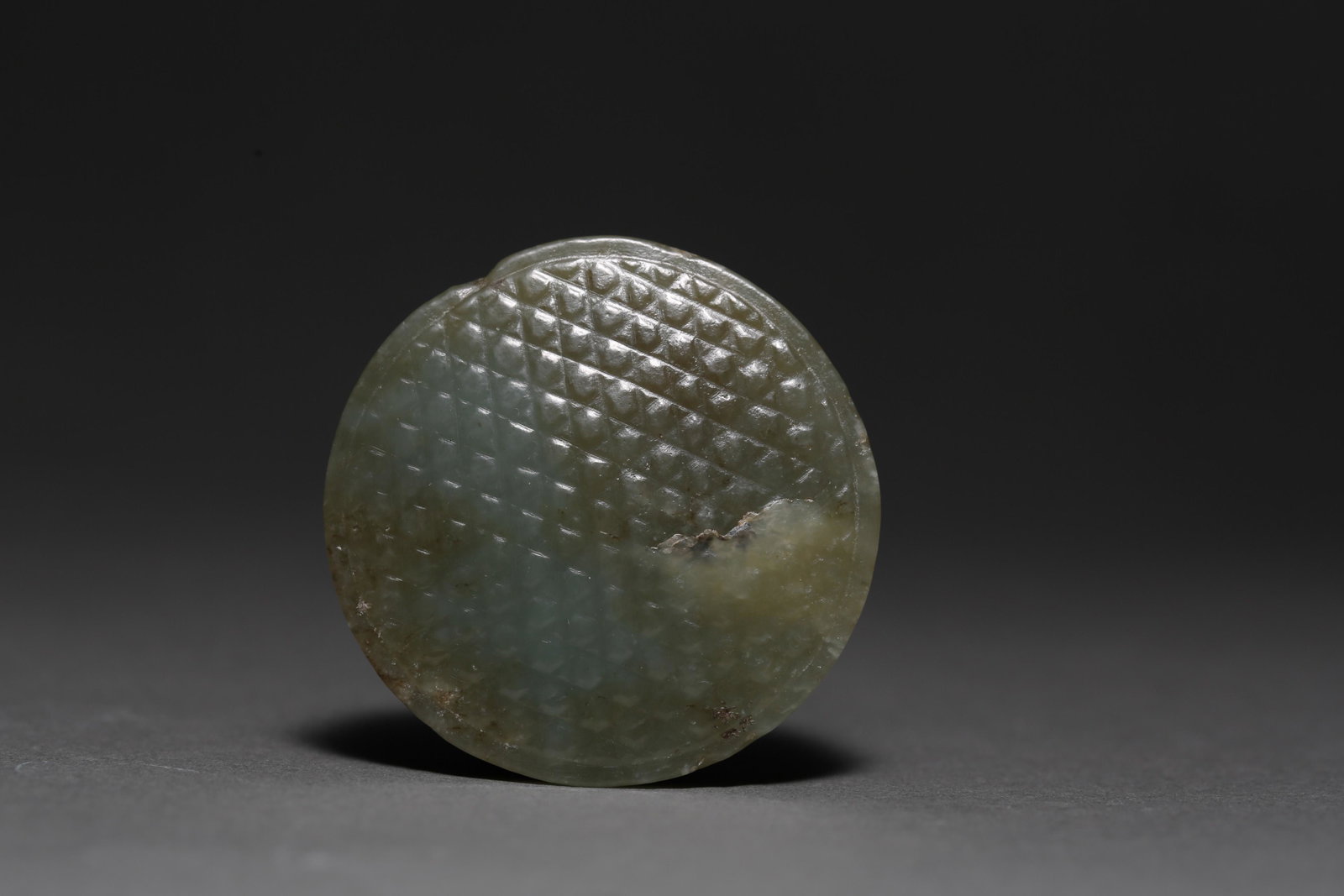 A Round Jade Sword Head Han dynasty: Size:Dia 35mm Date:Bc202-Ac220 Provenance: China.